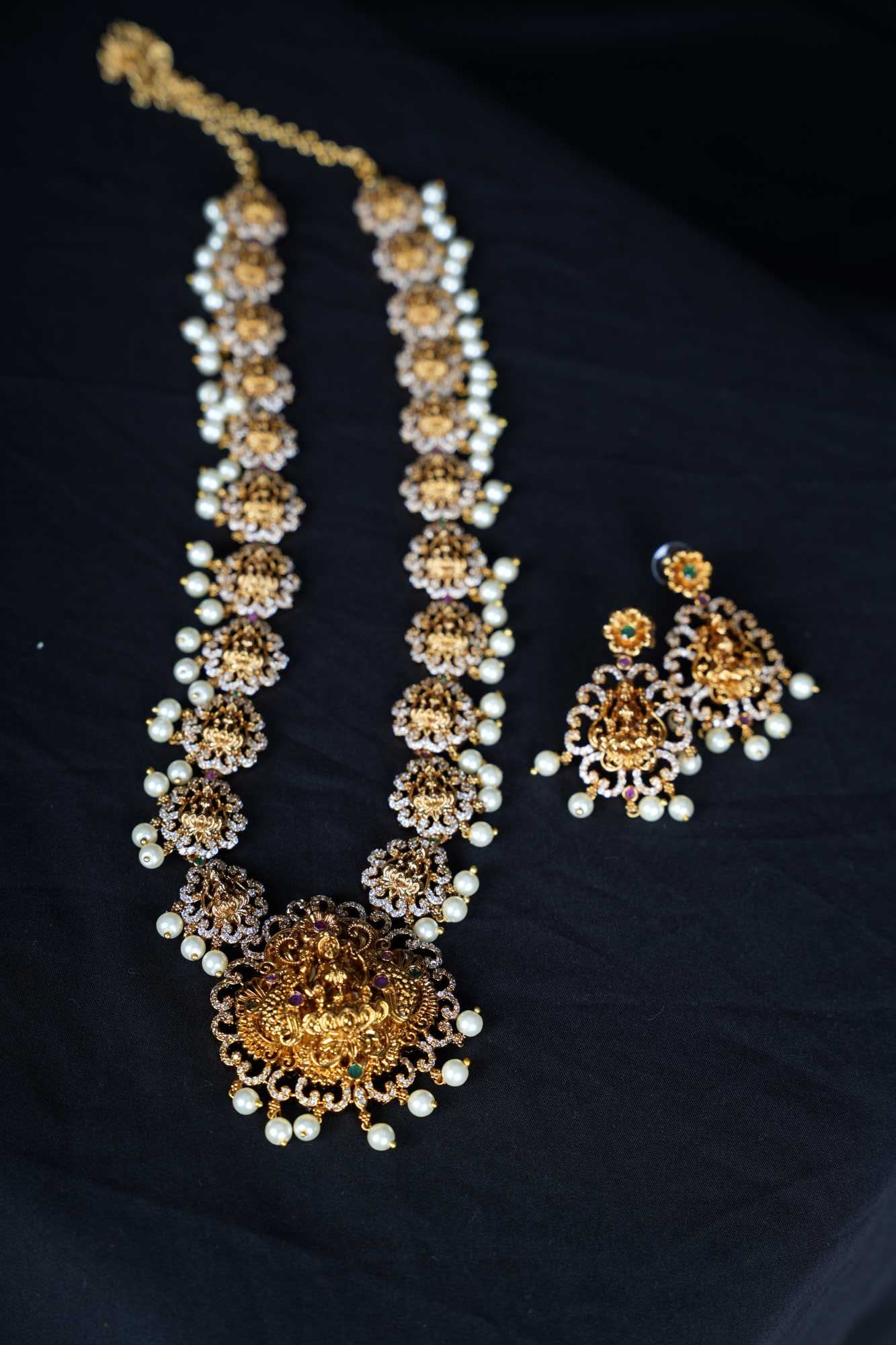 Regal Goddess Temple Jewelry Set with Intricate Gold Detailing and Pearl Accents