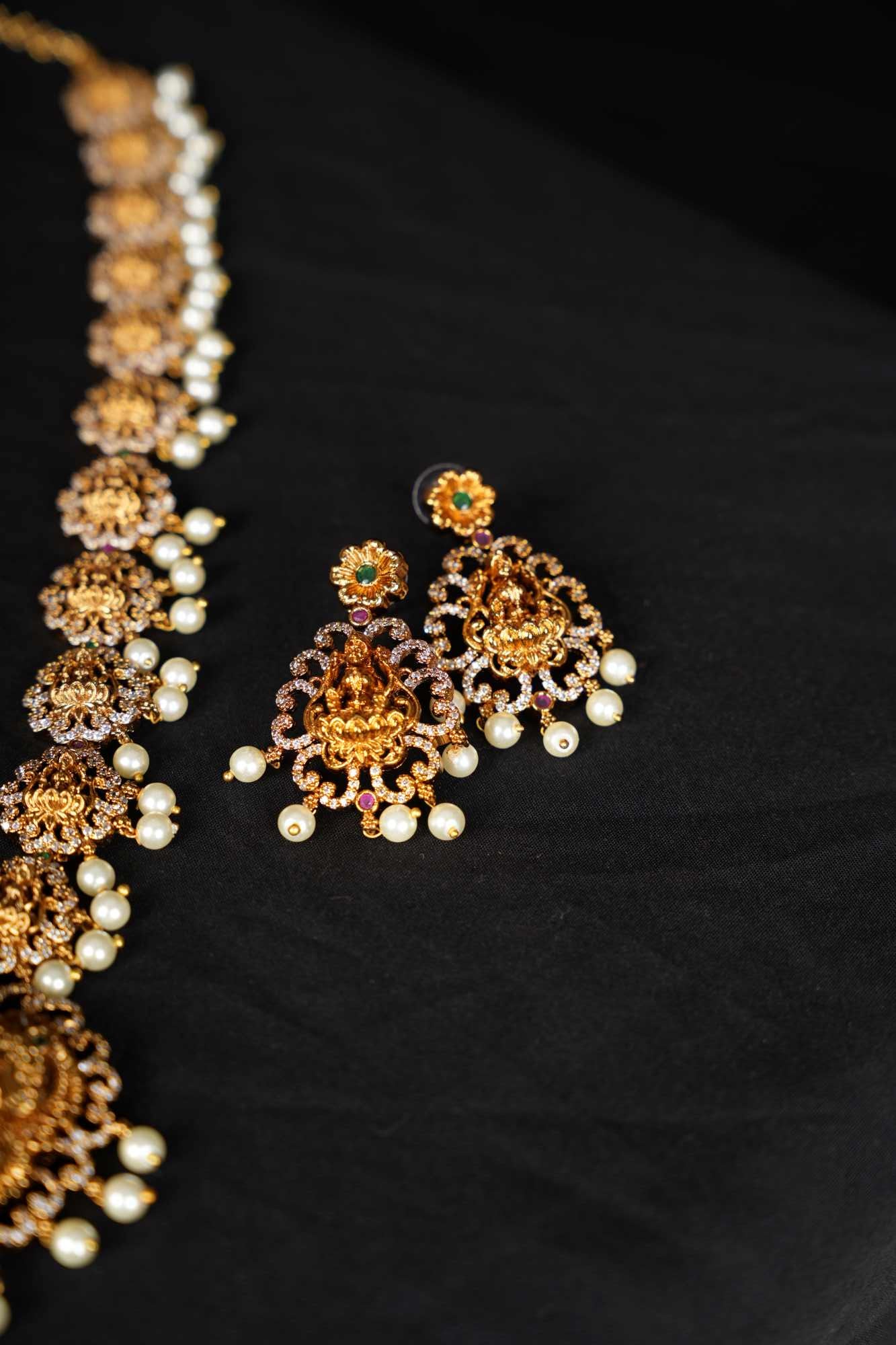 Regal Goddess Temple Jewelry Set with Intricate Gold Detailing and Pearl Accents