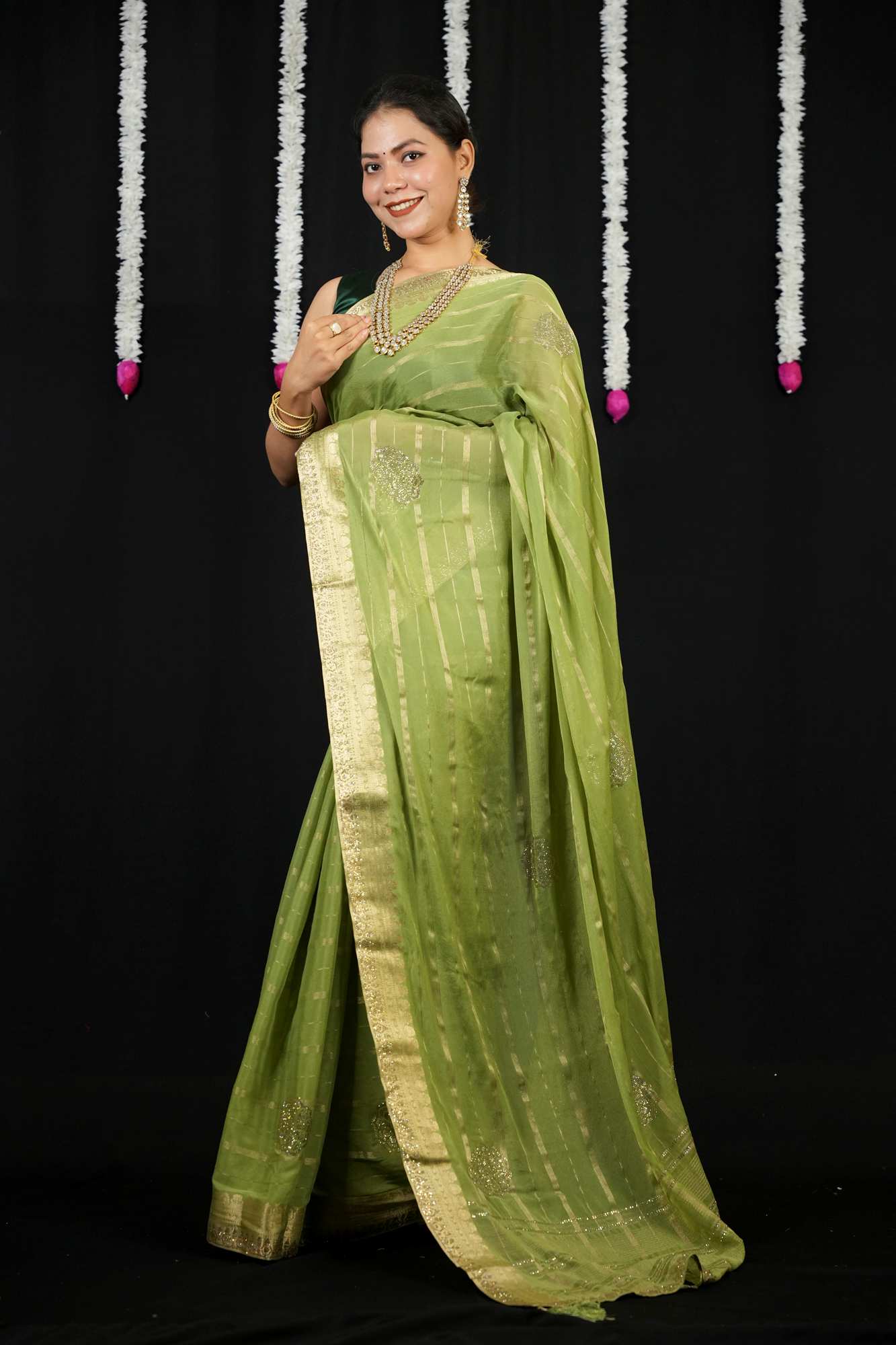 Chiffon with Zari Stripes, Floral Motifs & Stone Embellishments Ready To wear Saree