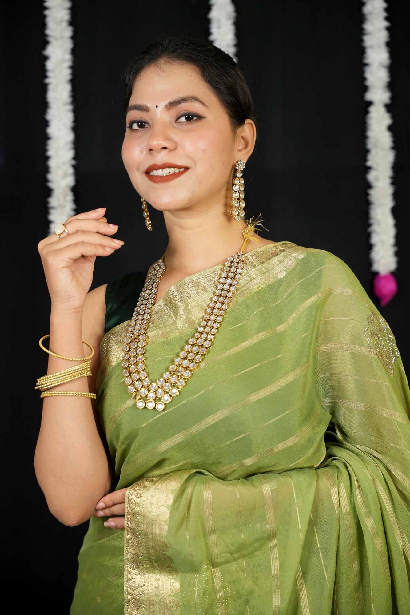 Chiffon with Zari Stripes, Floral Motifs & Stone Embellishments Ready To wear Saree