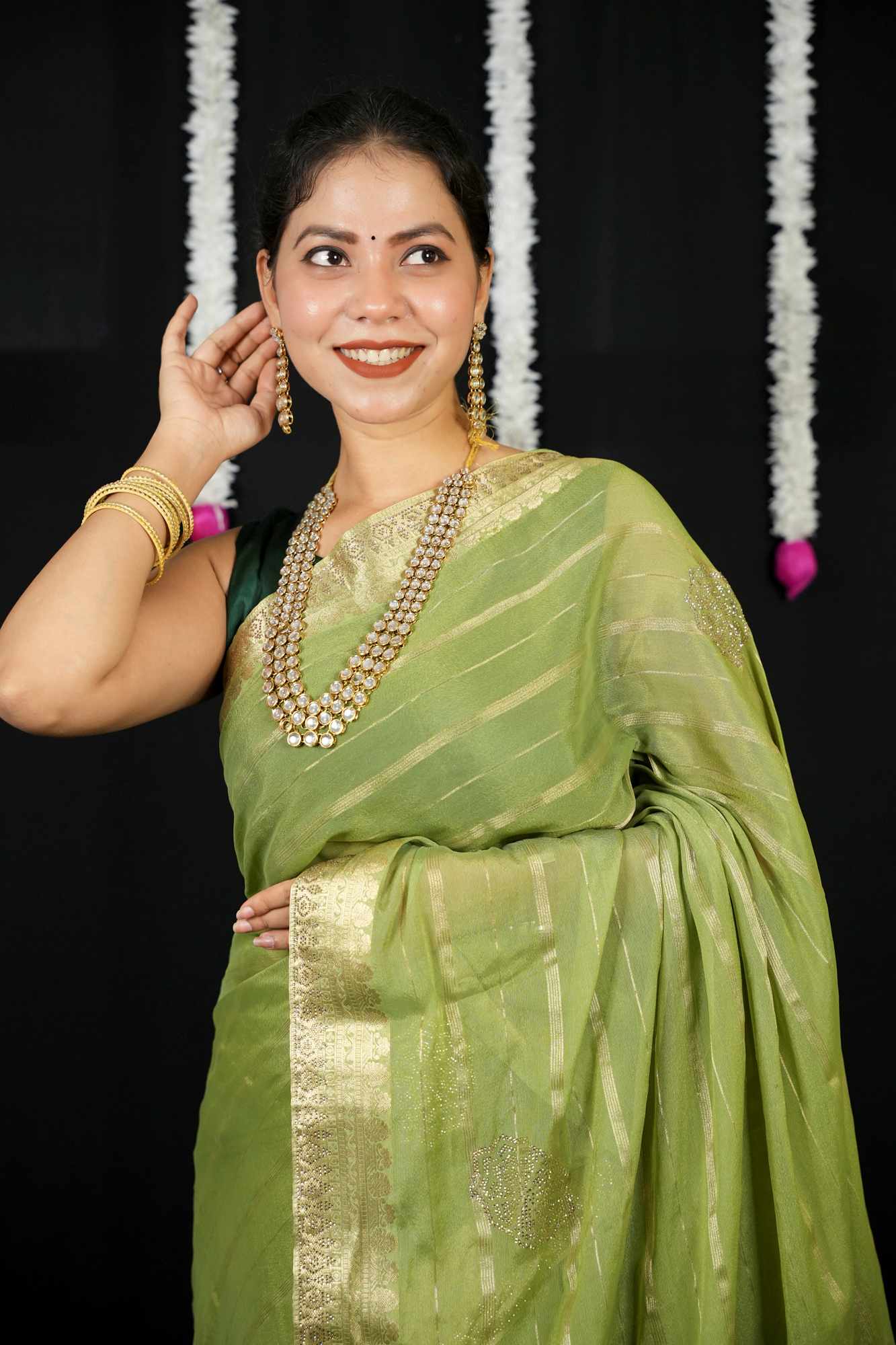 Chiffon with Zari Stripes, Floral Motifs & Stone Embellishments Ready To wear Saree