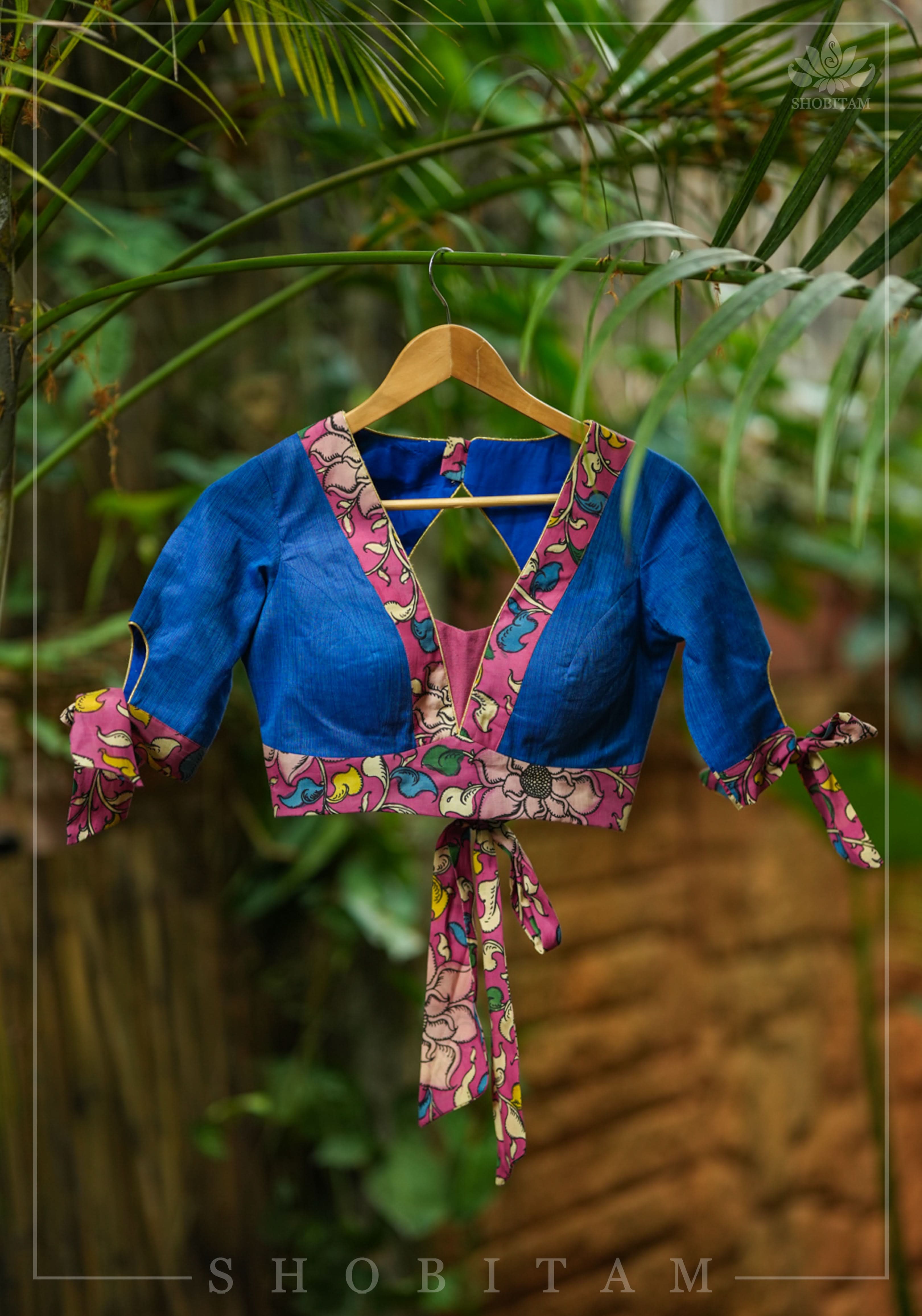 Ocean blue handloom V neck blouse with rose pink handpainted kalamkari border detailing. | Shobitam