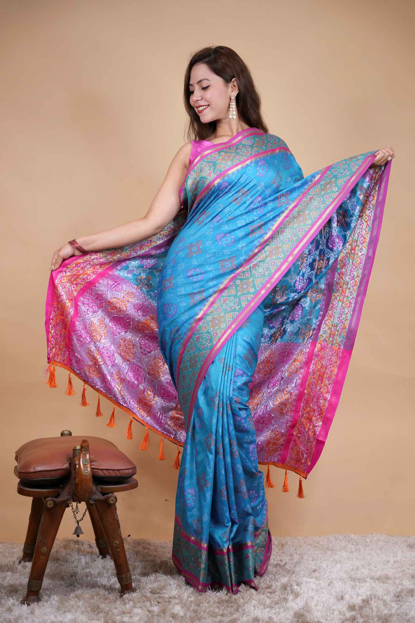 Firozi Patola weave and zari interwoven with resham border tassels i pallu prestitched saree