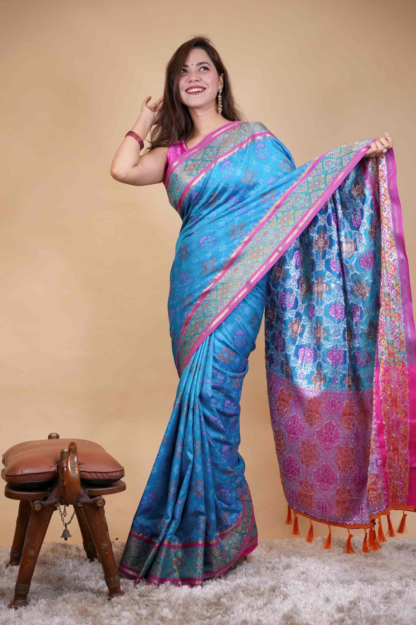 Firozi Patola weave and zari interwoven with resham border tassels i pallu prestitched saree