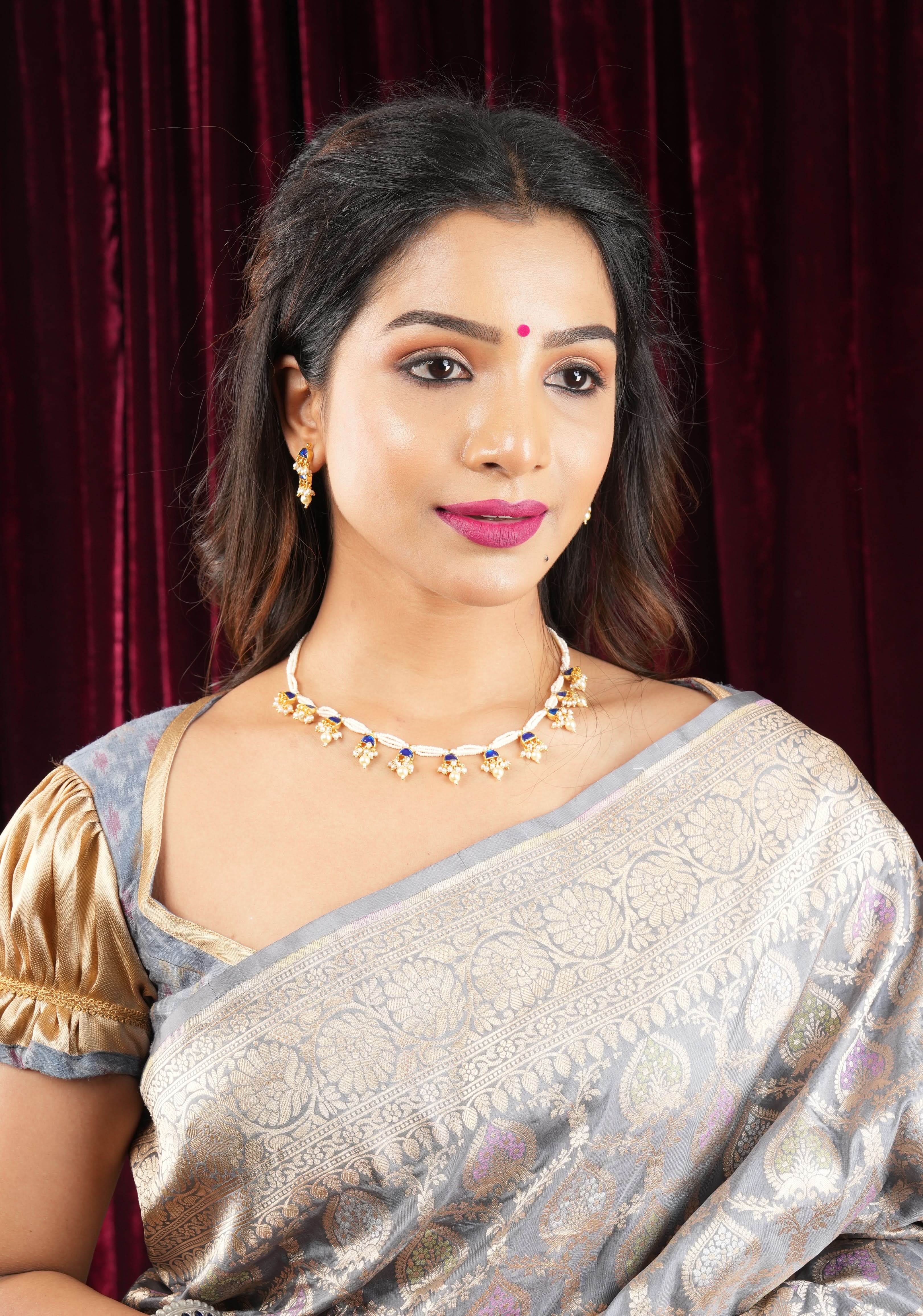Lightweight Jadau Necklace Set with eleven dangling royal blue stones and matching earrings | Shobitam Jewelry