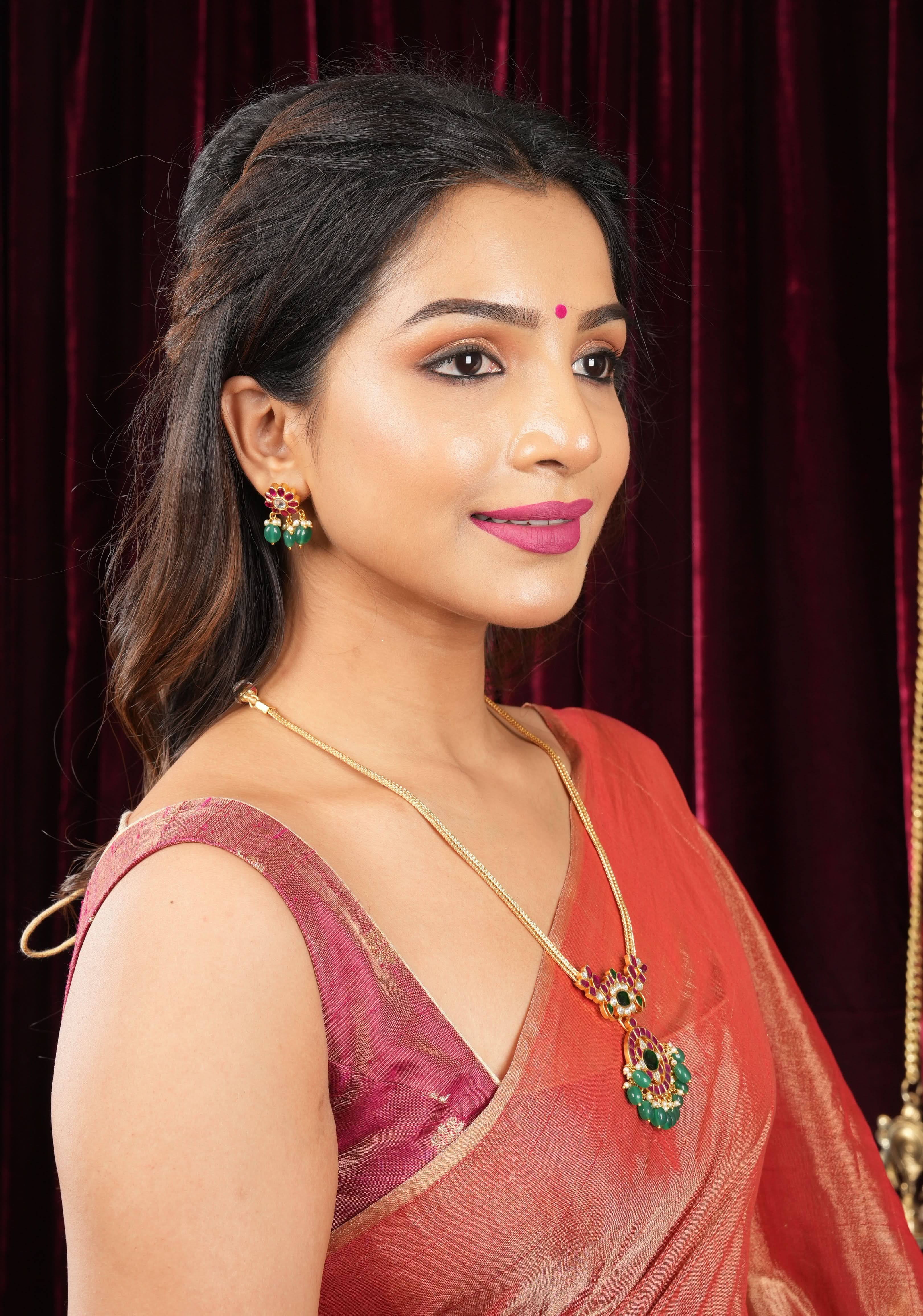 Deep Square Neck Sleeveless blouse in Reddish pink Pure Tissue Raw silk with zari buttas | Shobitam