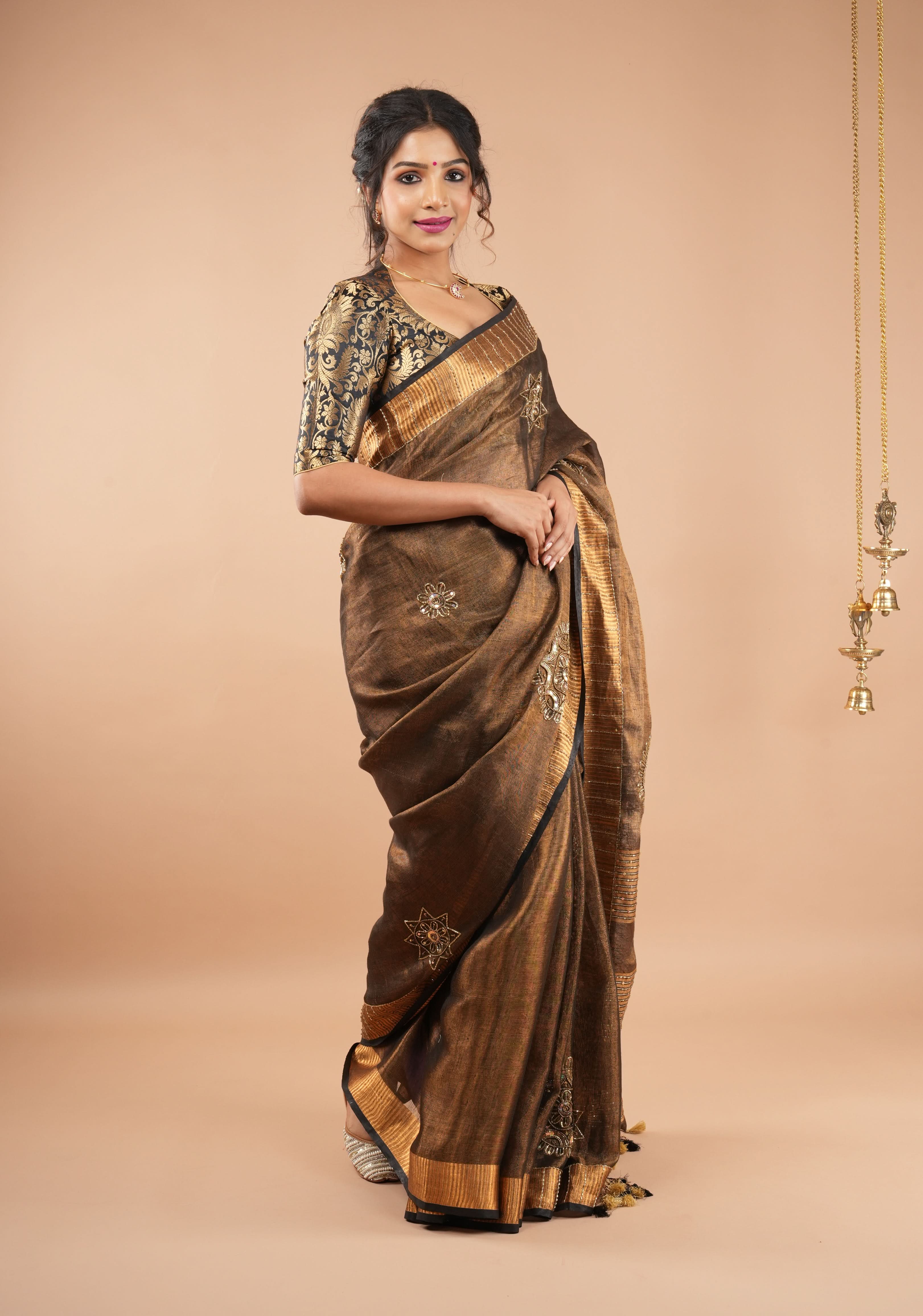 Embroidery cut dana with seqins Work Tissue Linen Saree in copper black with dramatic work Pallu | Shobitam