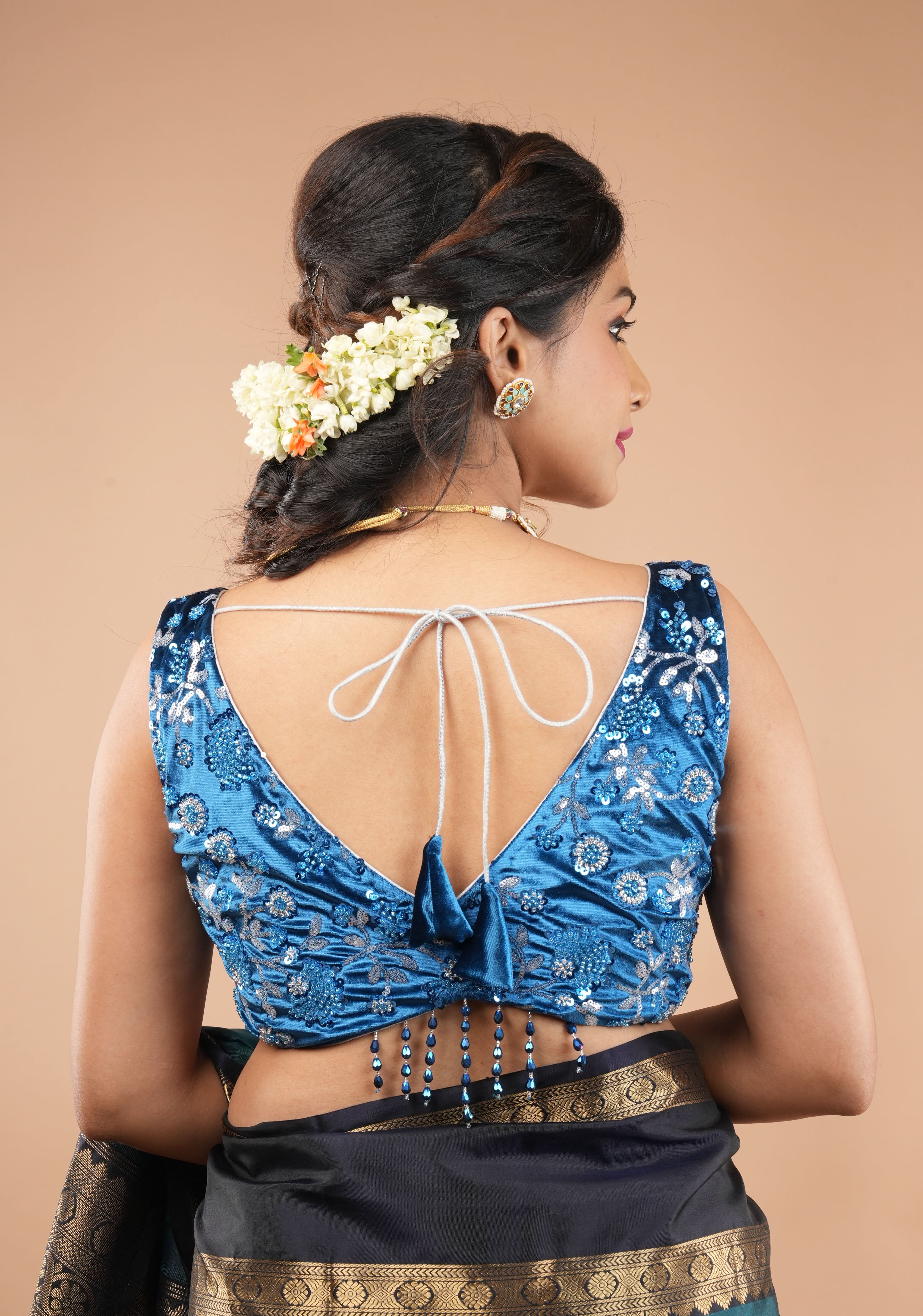 Cobalt Blue Velvet floral embroidery and sequins sleeveless blouse with blue dangling beads at the back | Shobitam