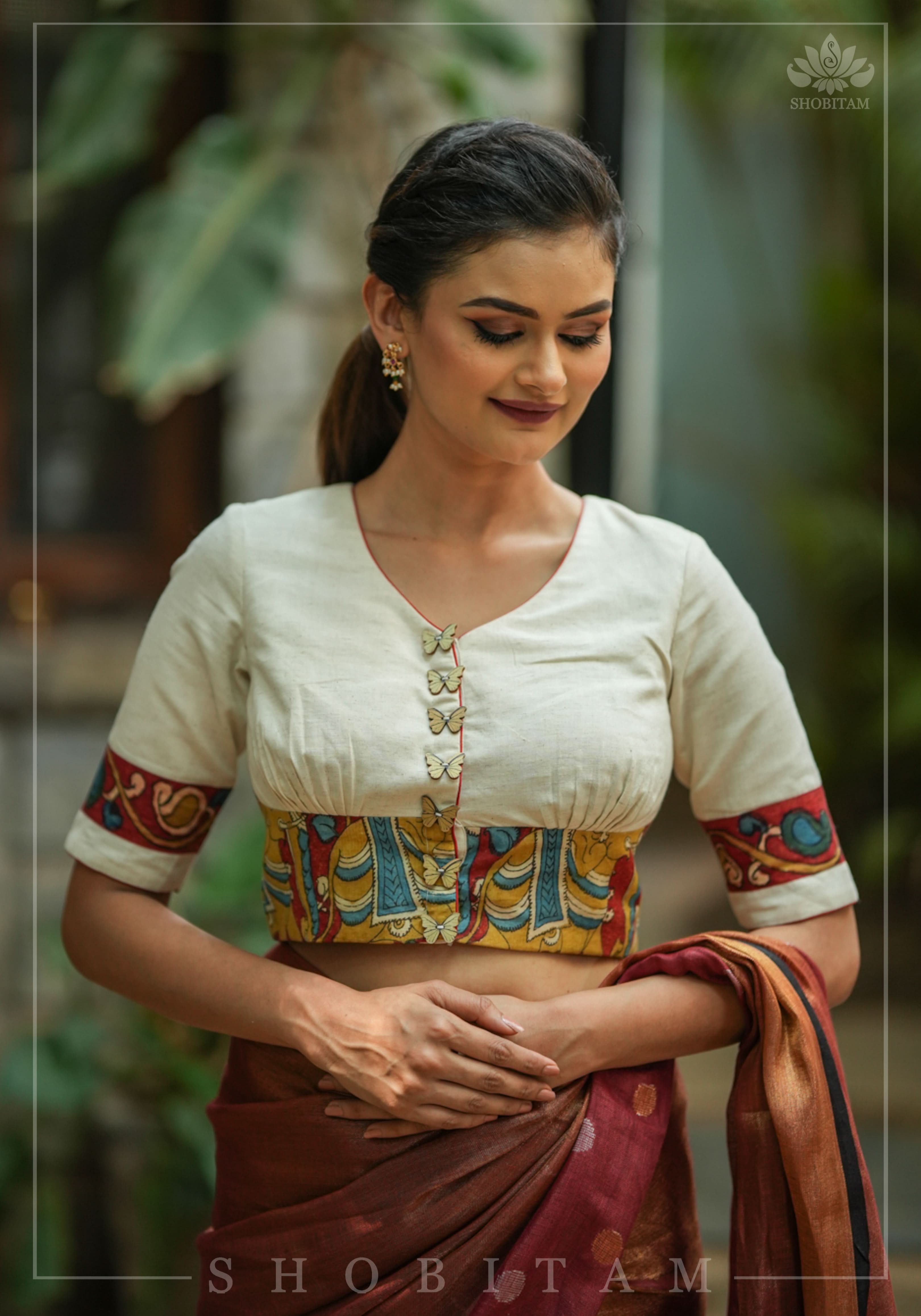 Daisy white V neck blouse with handpainted kalamkari border | Shobitam