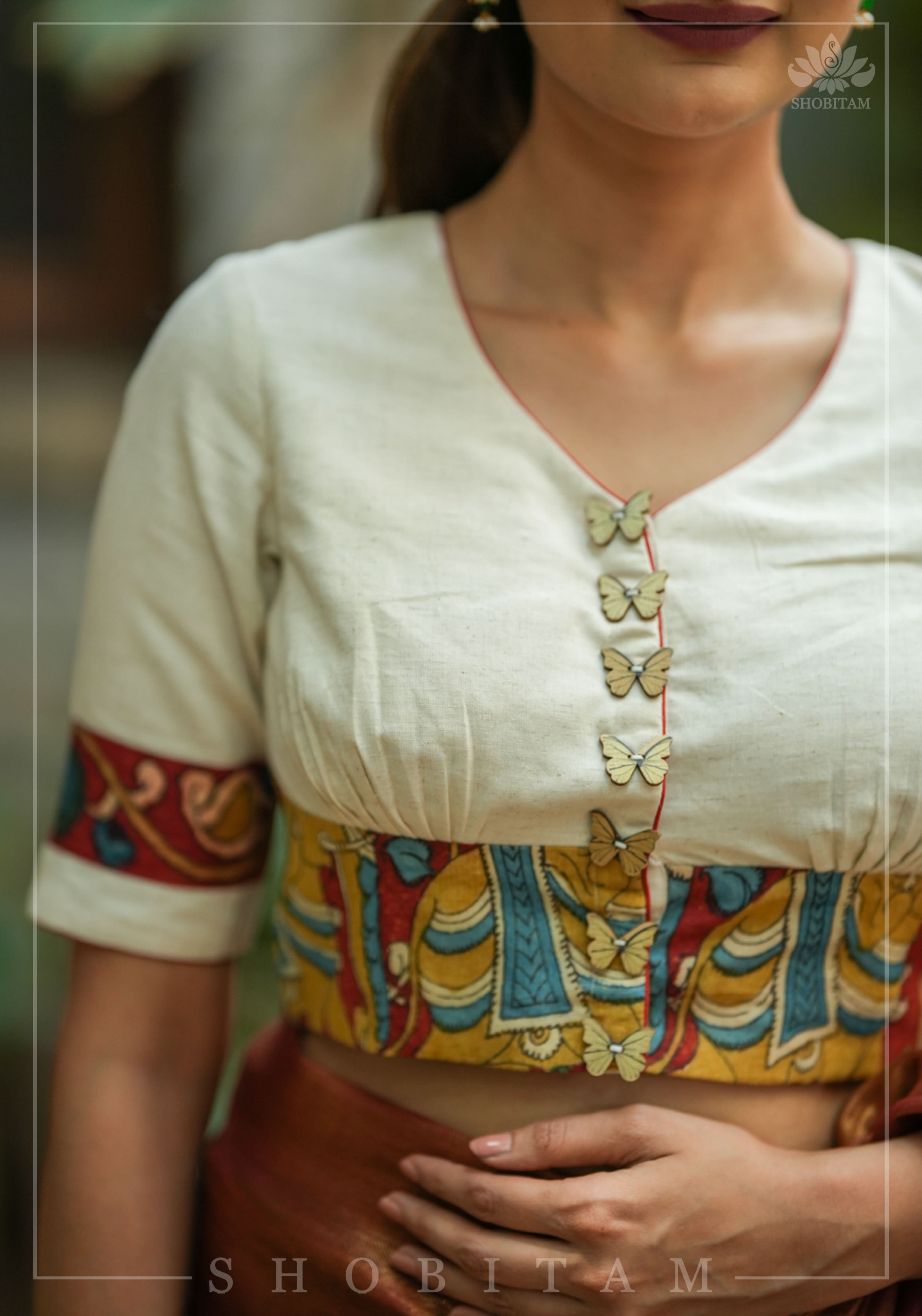 Daisy white V neck blouse with handpainted kalamkari border | Shobitam