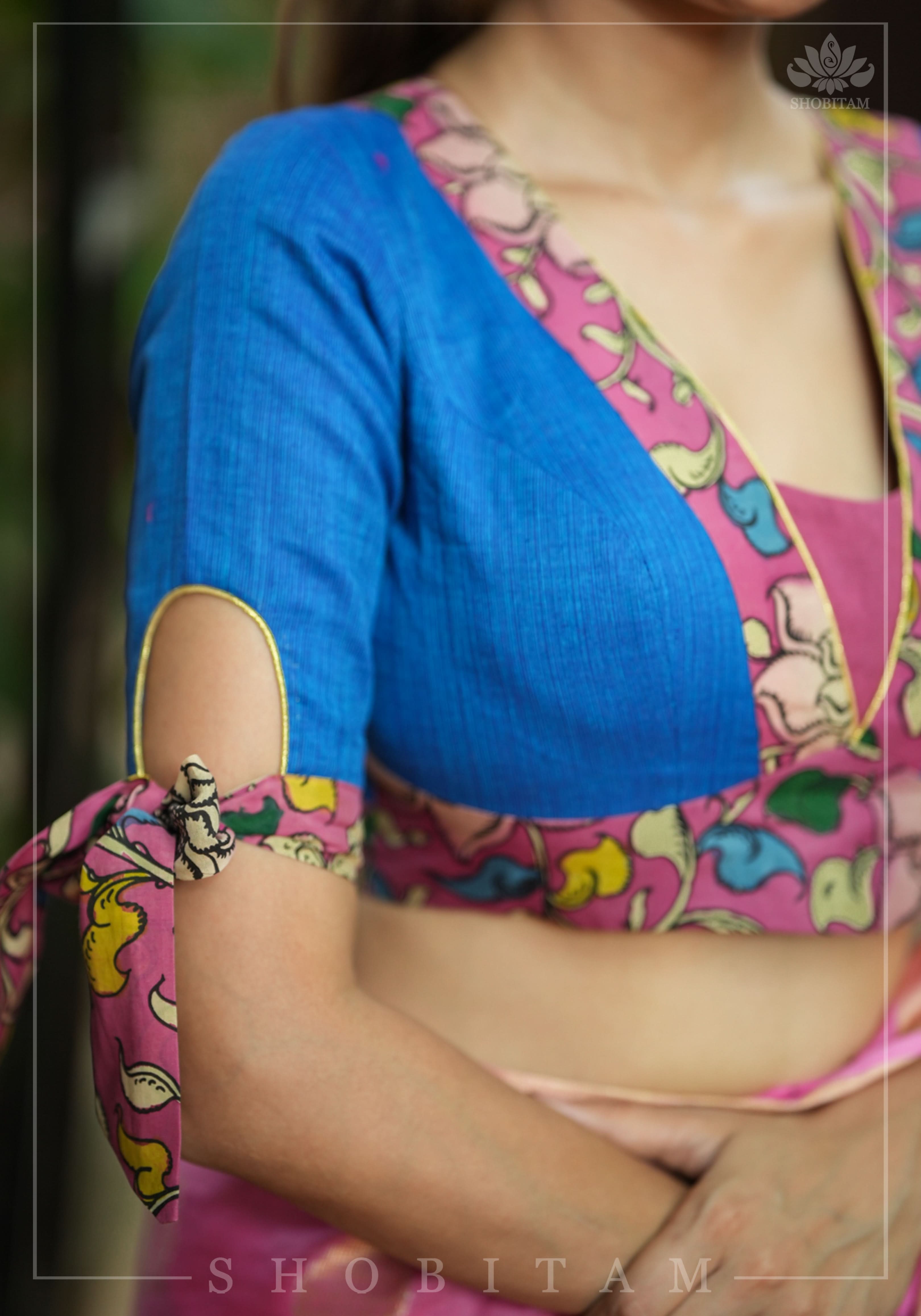 Ocean blue handloom V neck blouse with rose pink handpainted kalamkari border detailing. | Shobitam