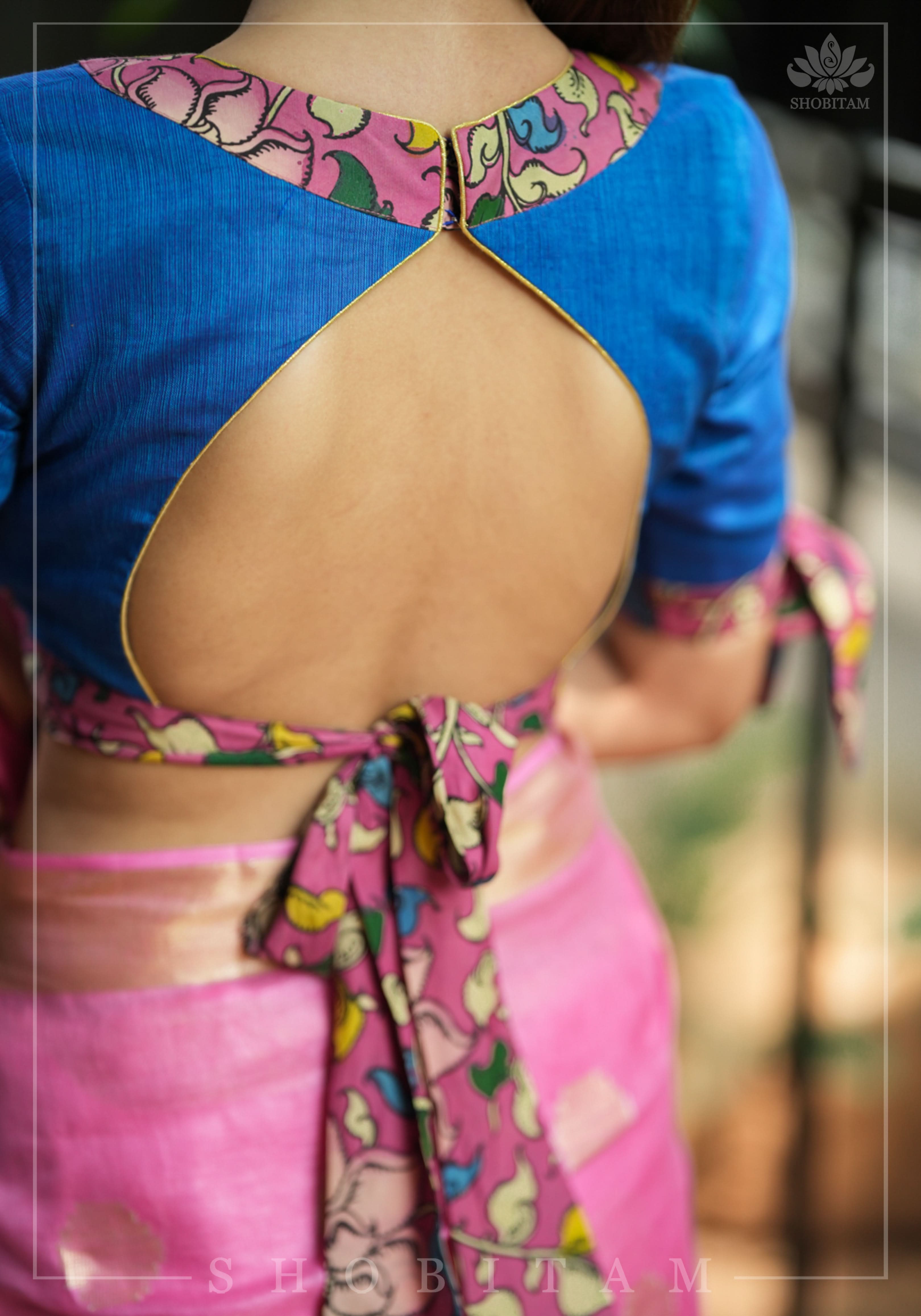 Ocean blue handloom V neck blouse with rose pink handpainted kalamkari border detailing. | Shobitam