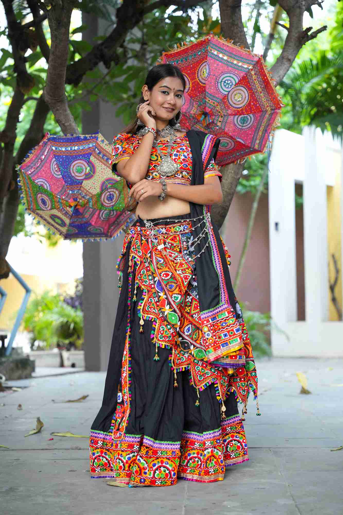 Black Kutchi Hand-Embroidered Ghagra Choli with Vibrant Mirror Work and Multicolor Thread Embellishments