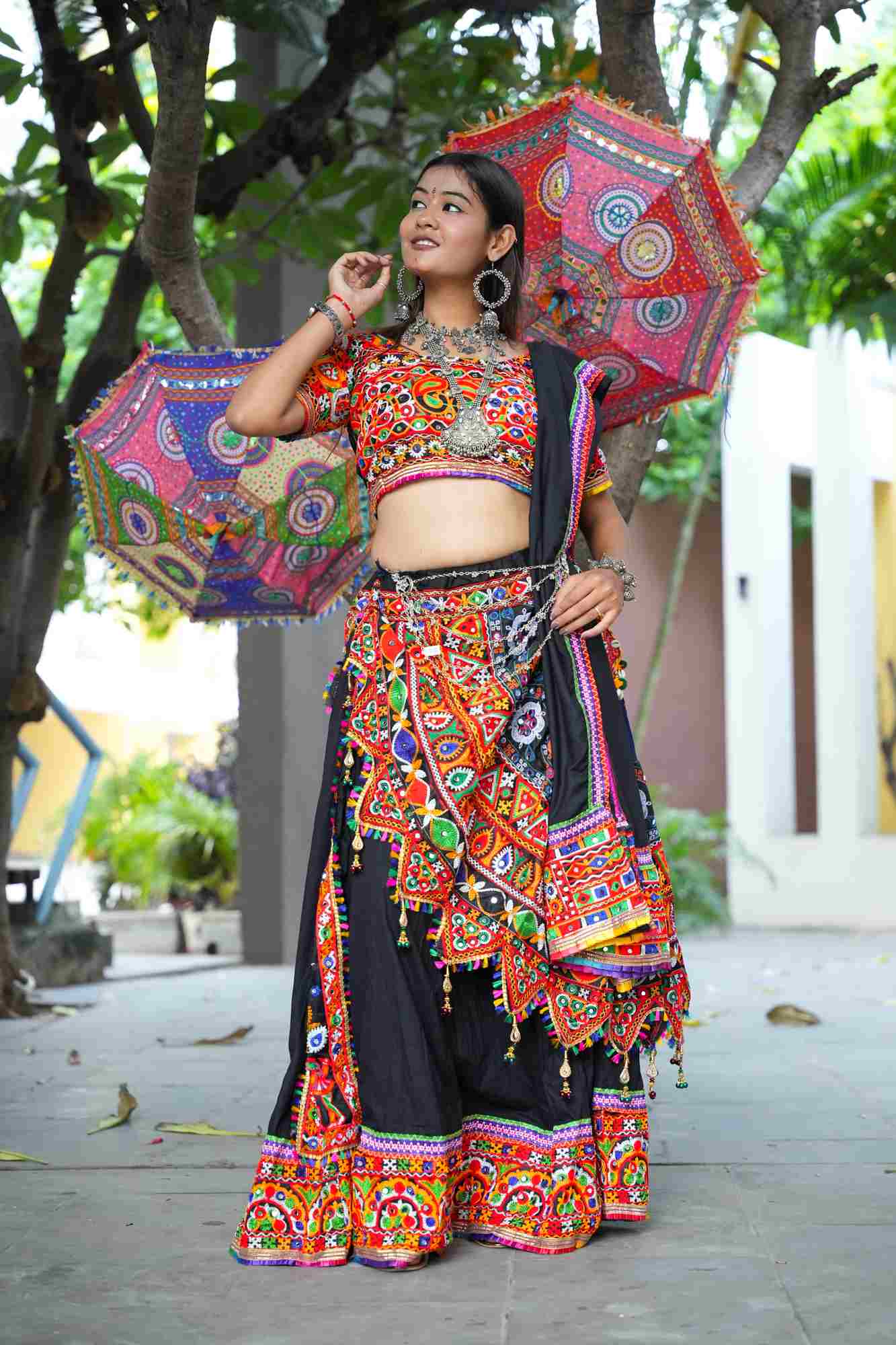Black Kutchi Hand-Embroidered Ghagra Choli with Vibrant Mirror Work and Multicolor Thread Embellishments