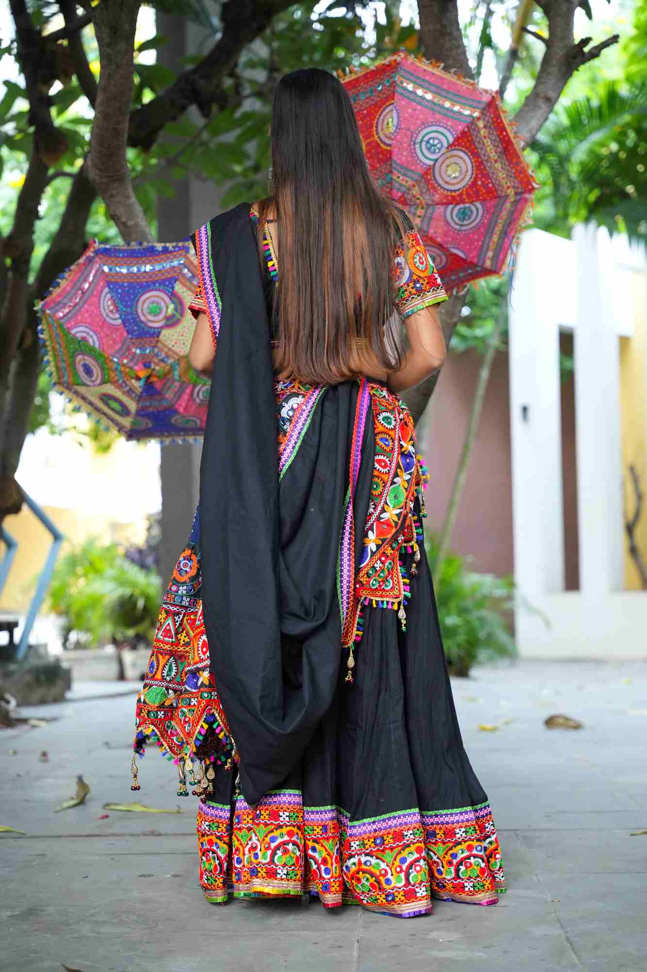 Black Kutchi Hand-Embroidered Ghagra Choli with Vibrant Mirror Work and Multicolor Thread Embellishments