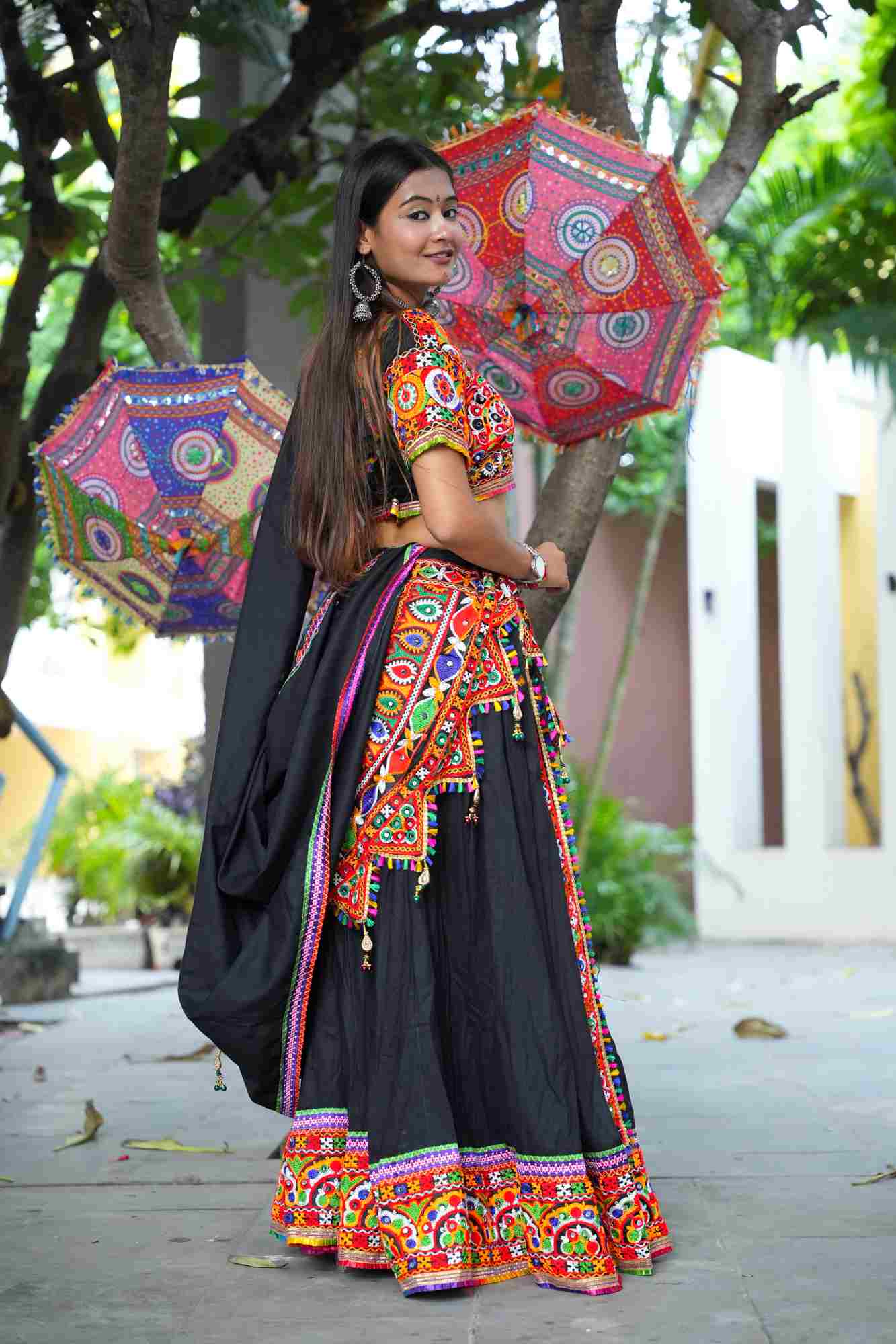 Black Kutchi Hand-Embroidered Ghagra Choli with Vibrant Mirror Work and Multicolor Thread Embellishments