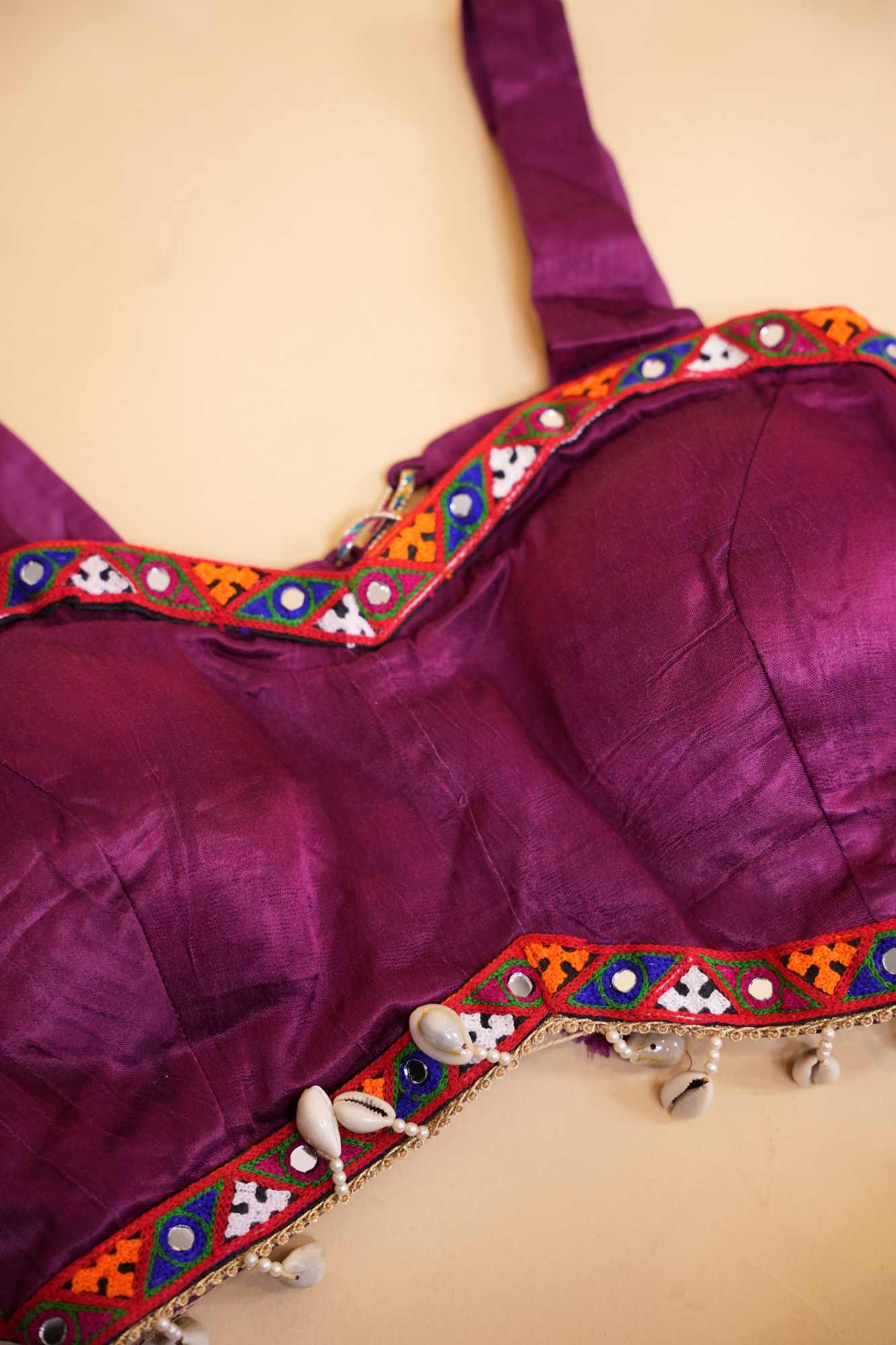 Stylish Navratri-Inspired Purple Blouse with Multicolor Embroidered Border & Cowrie Shell Accents