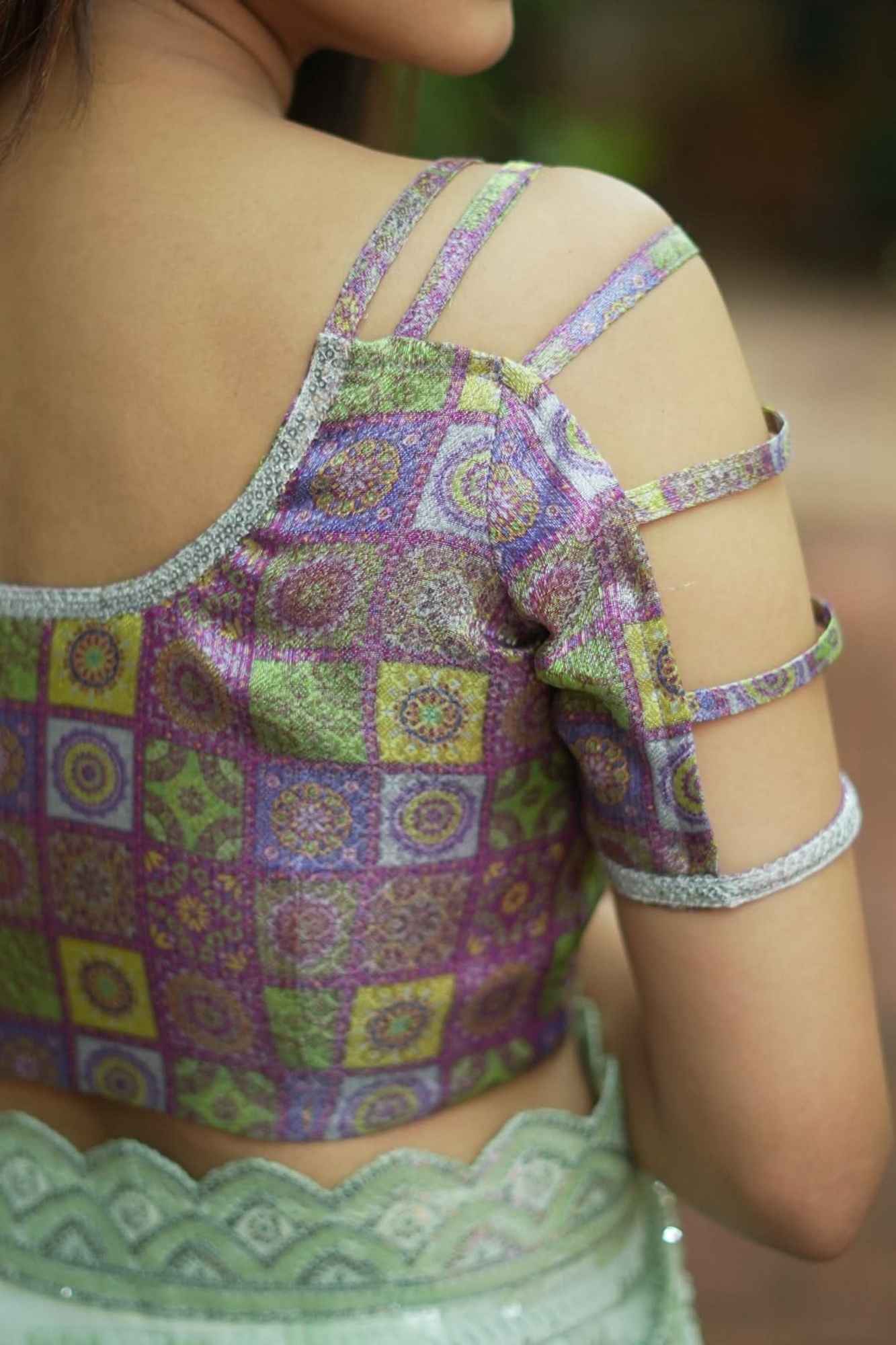 Multicolor Printed Blouse on Lavender Base with multi-strapped sleeves