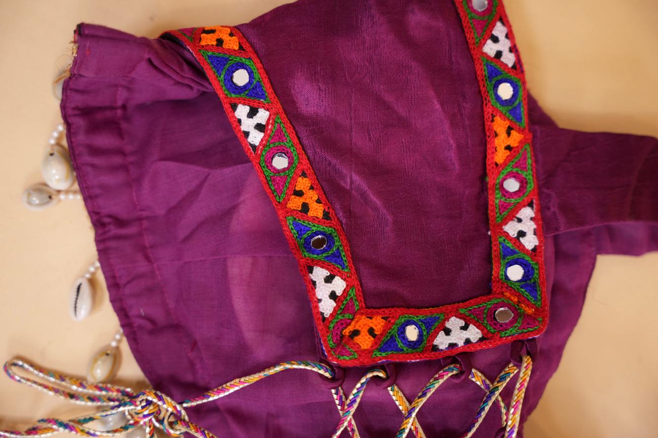 Stylish Navratri-Inspired Purple Blouse with Multicolor Embroidered Border & Cowrie Shell Accents