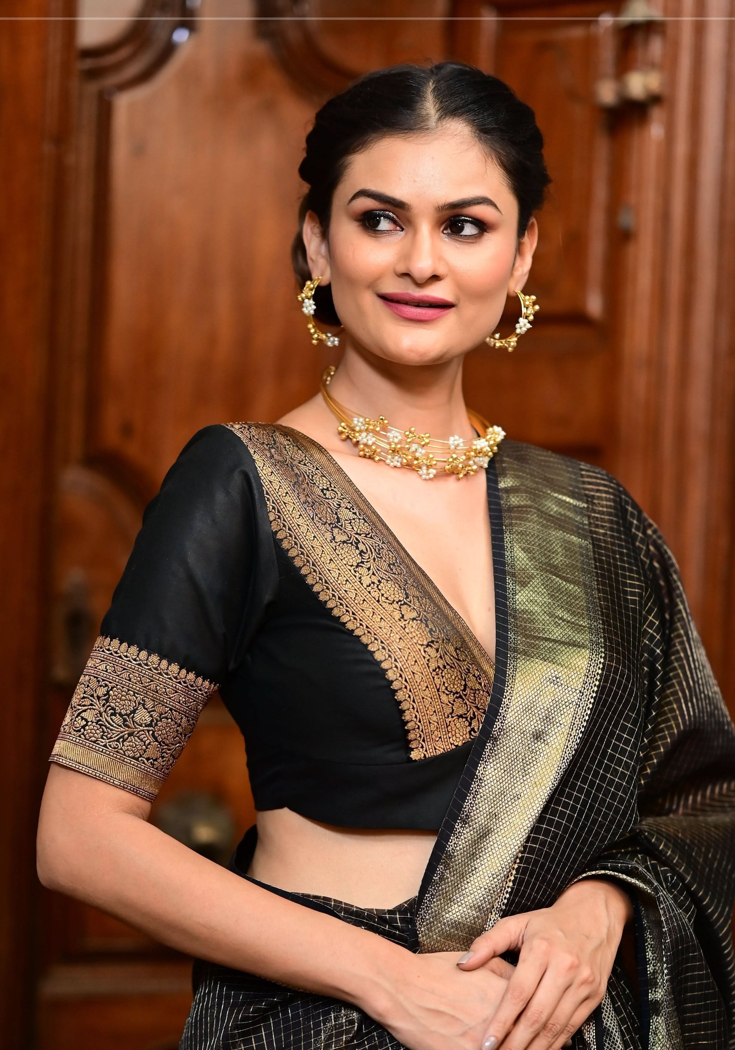 Black Blouse with Plunge Neck and Antique Tone Zari Detailing | Shobitam
