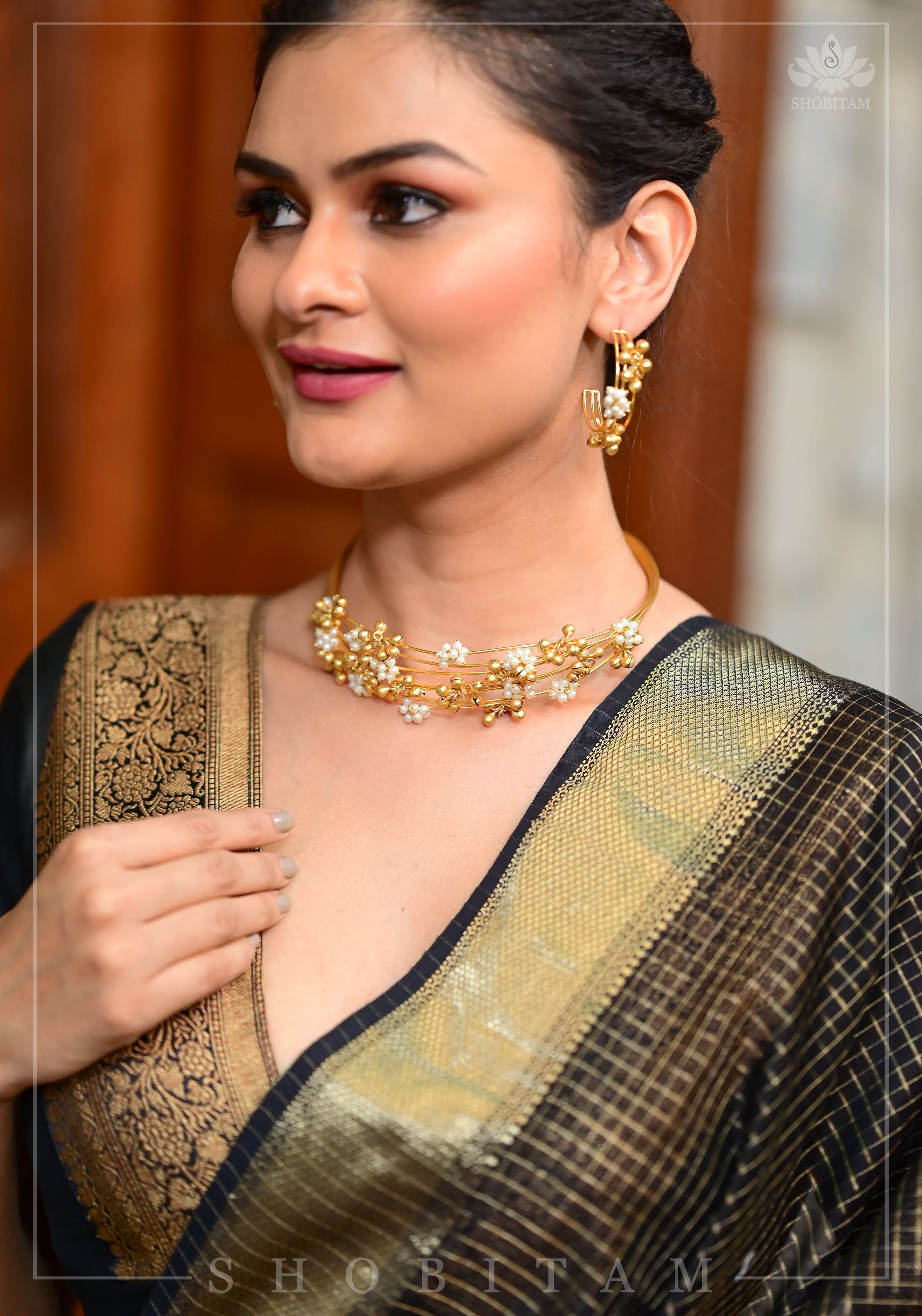 Black Blouse with Plunge Neck and Antique Tone Zari Detailing | Shobitam