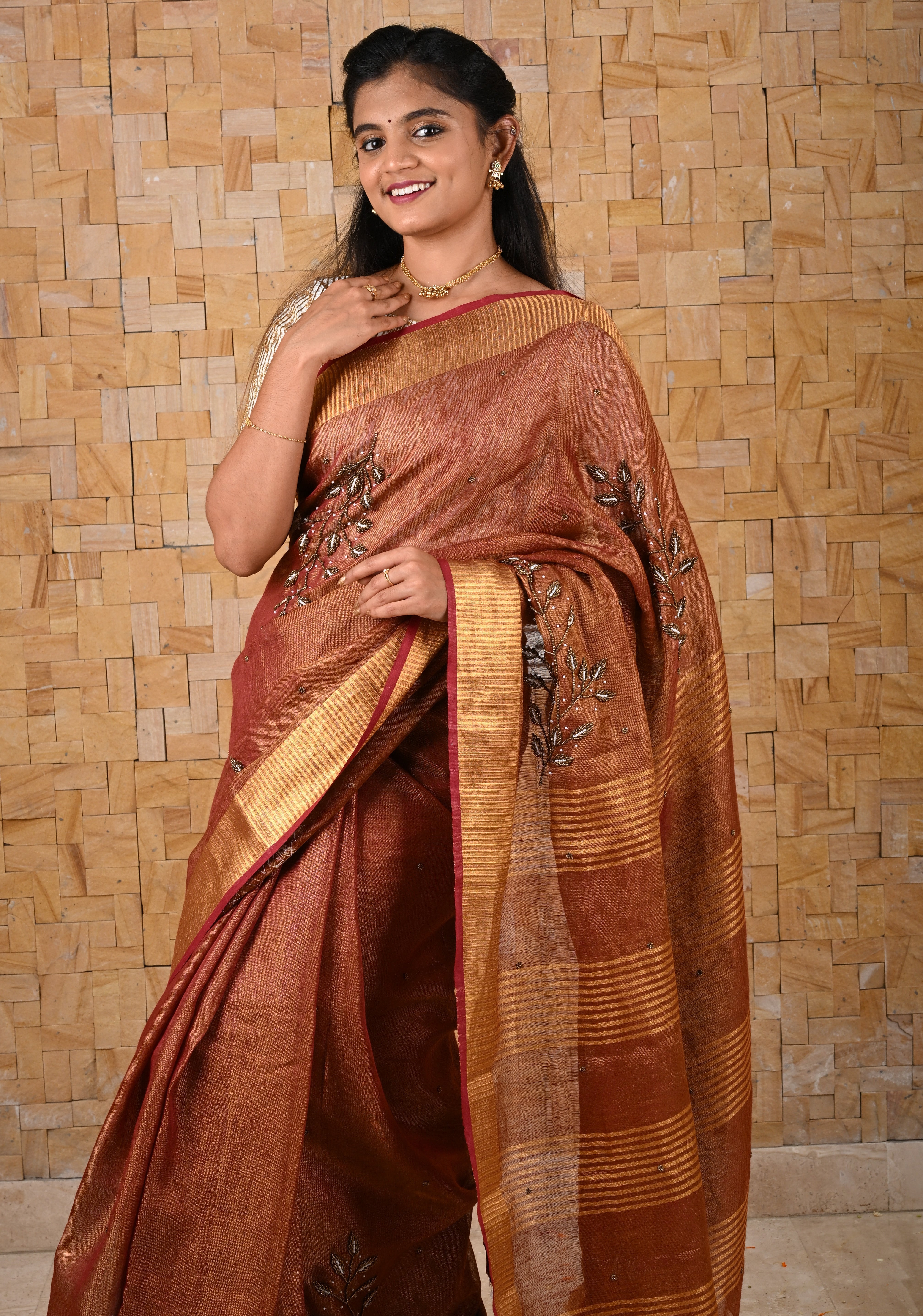Golden Tissue Linen Saree in Reddish-Brown with Bead Embellishments | Shobitam