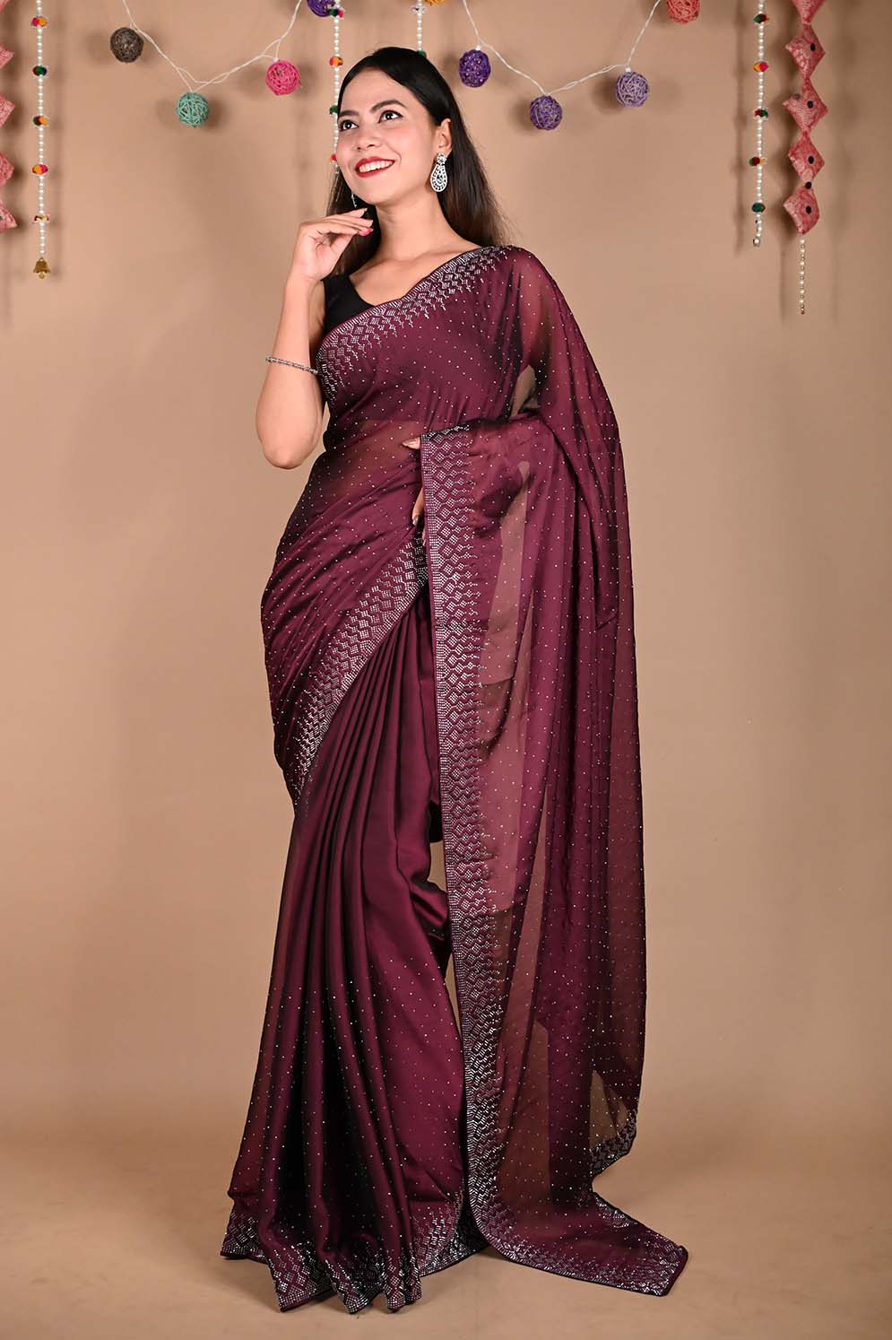 Maroon sequence work Georgette saree.