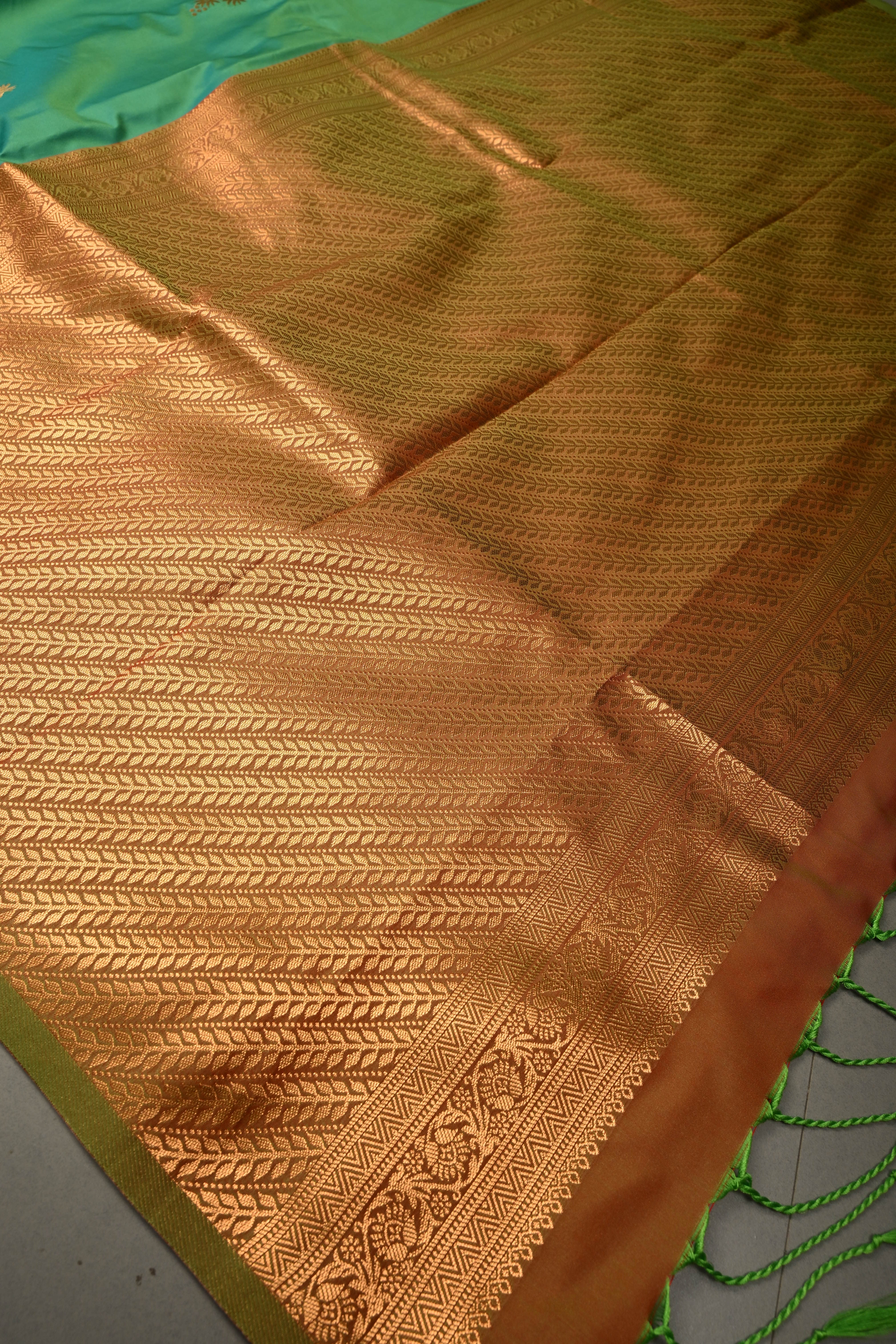 Green Kanchi Semi Silk Saree with Floral Zari Buttas and Gold-Silver Motifs on Border | Shobitam