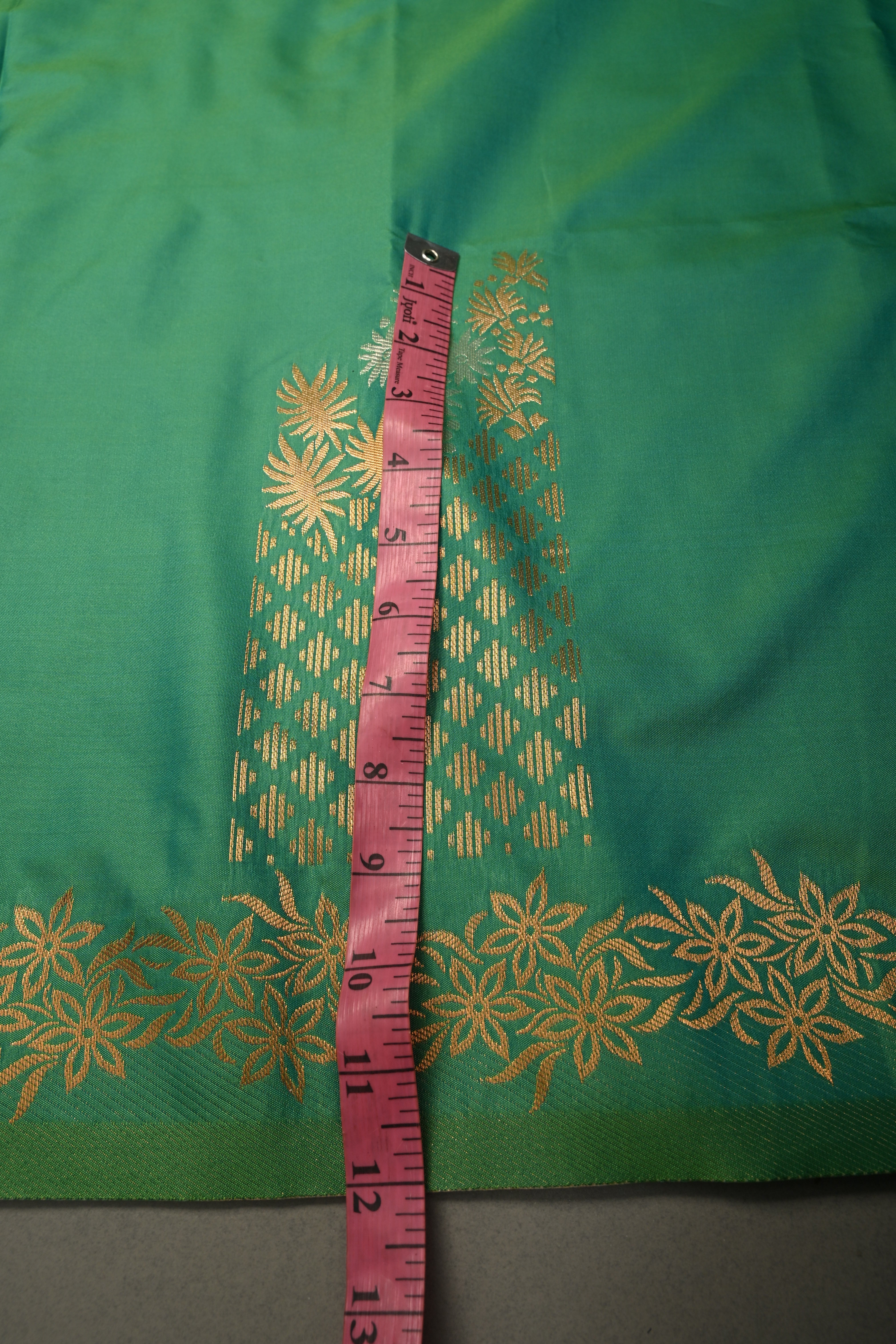 Green Kanchi Semi Silk Saree with Floral Zari Buttas and Gold-Silver Motifs on Border | Shobitam