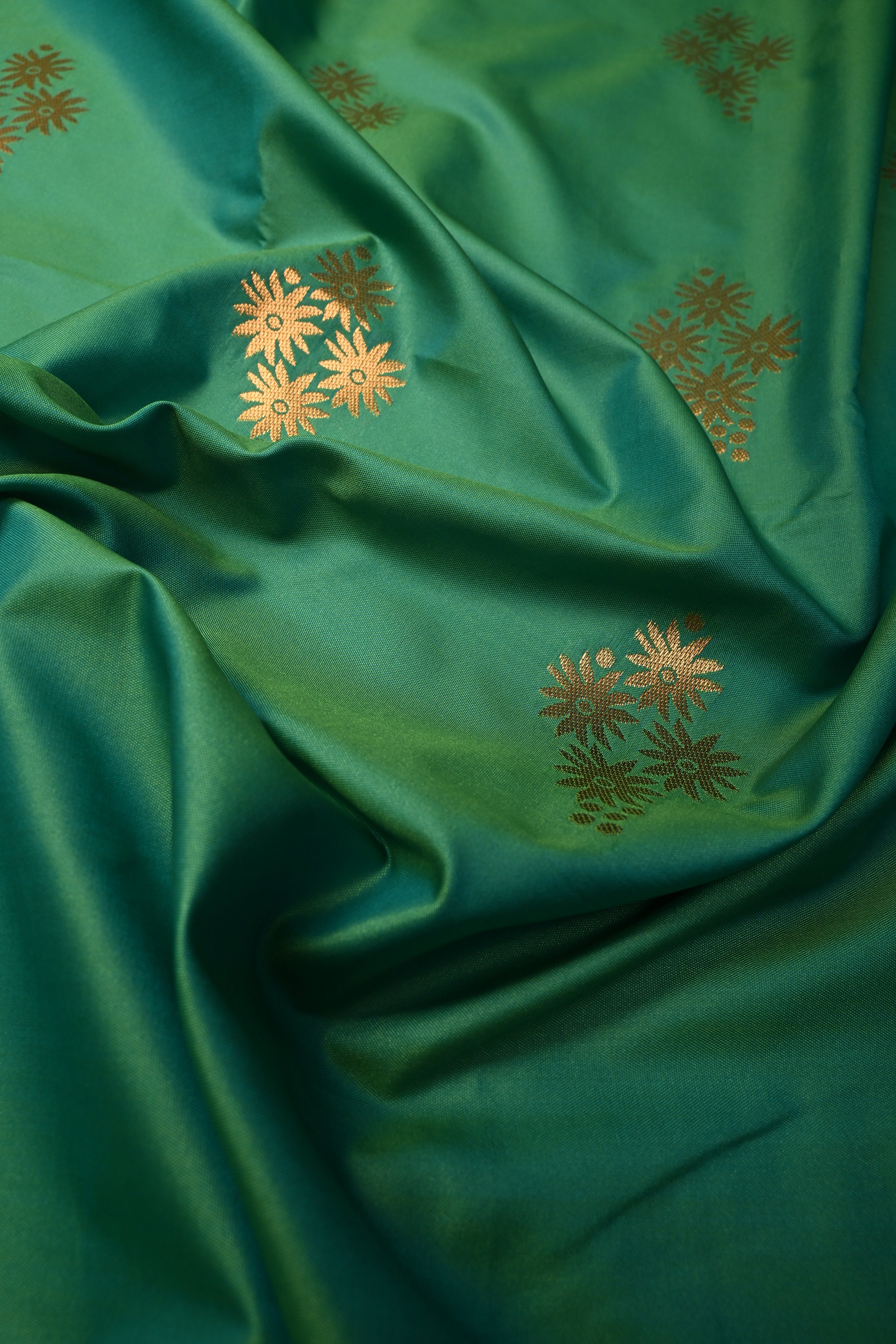 Green Kanchi Semi Silk Saree with Floral Zari Buttas and Gold-Silver Motifs on Border | Shobitam