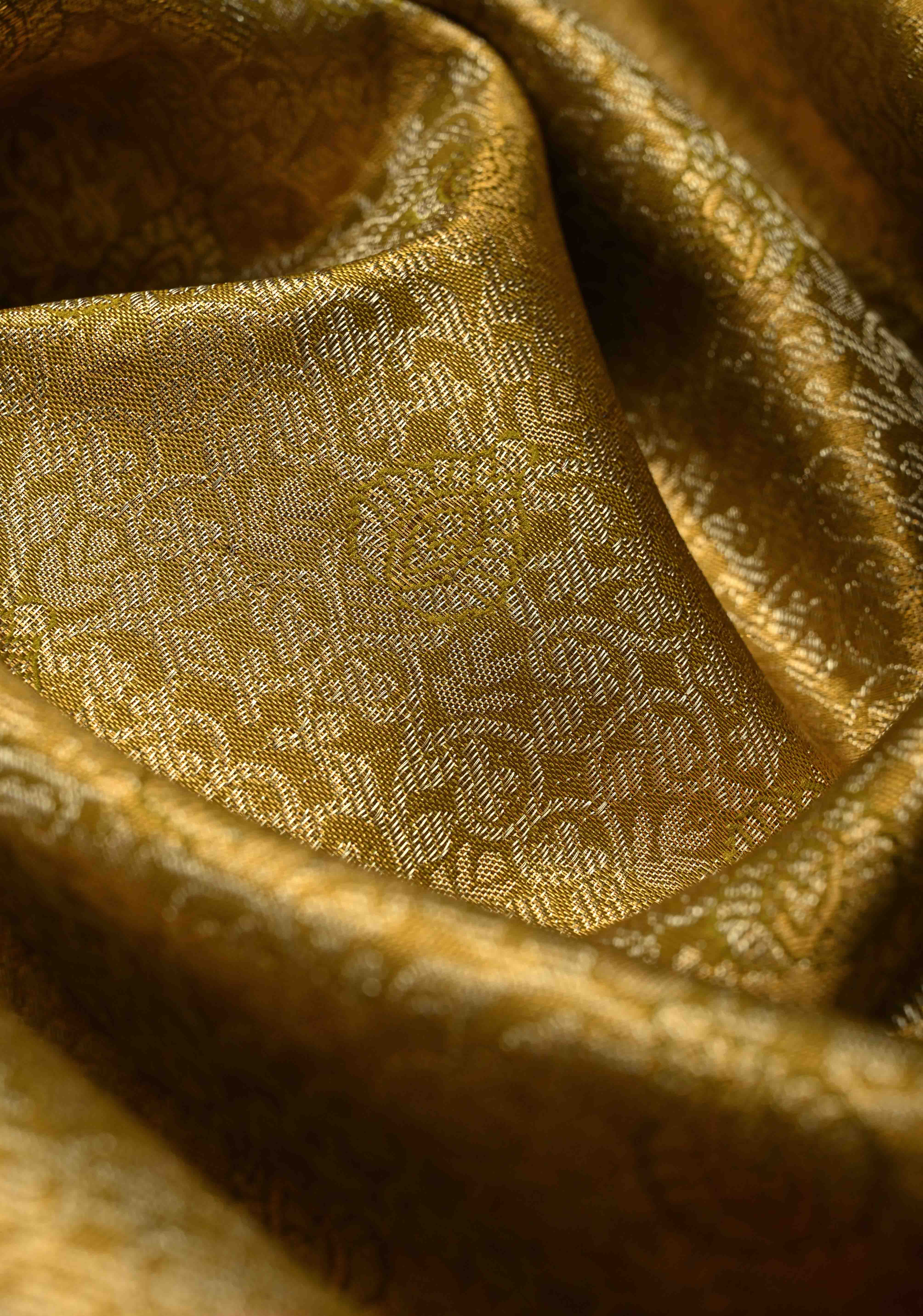 Ollive Green Kanjivaram Tissue Semi Silk Saree with Meenakari Floral Brocade Jaal and Contrast Zari Border | Shobitam