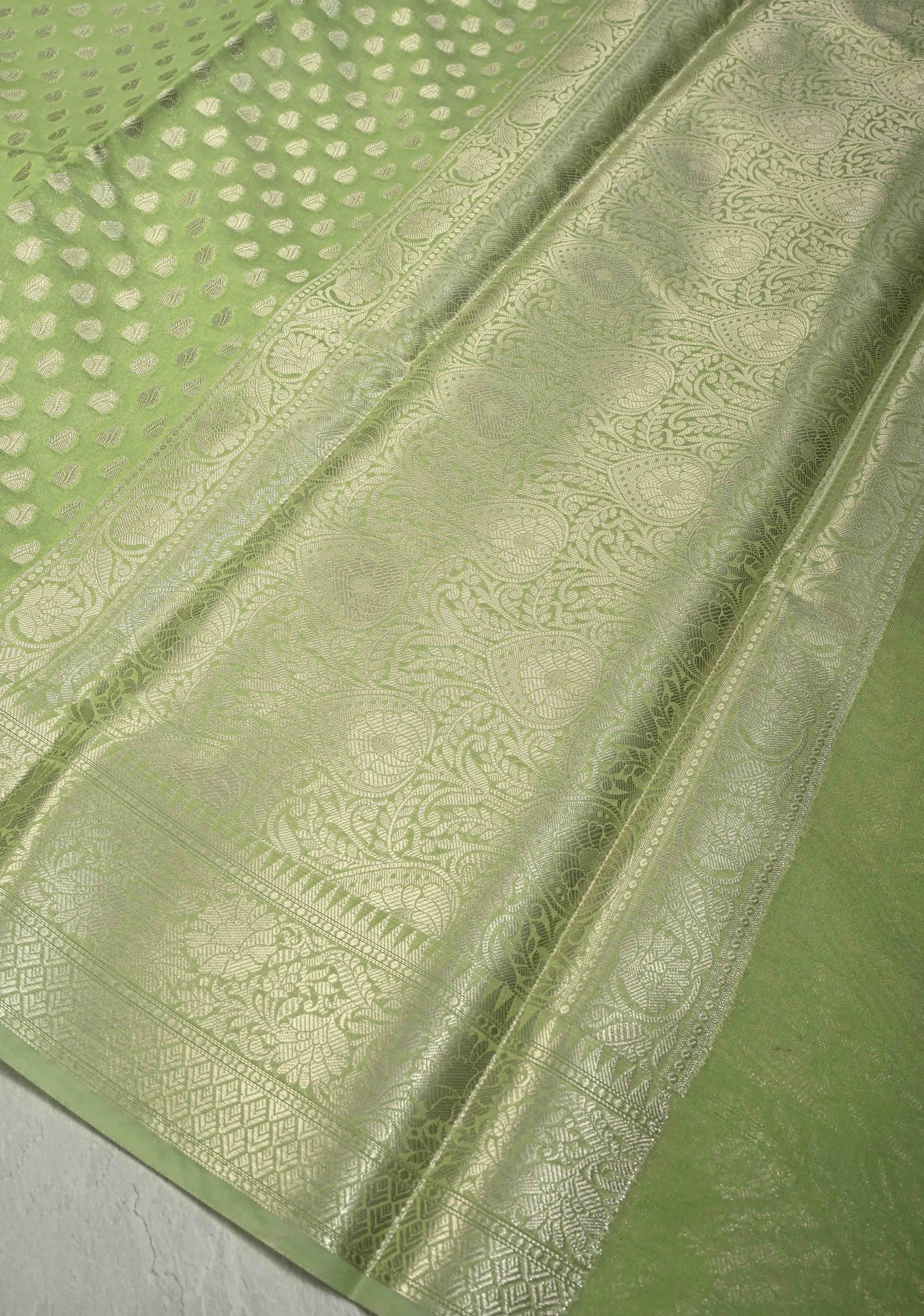 Pista Green Banarasi Semi Kora Saree with Silver Zari Buttas and Zari Border | Shobitam