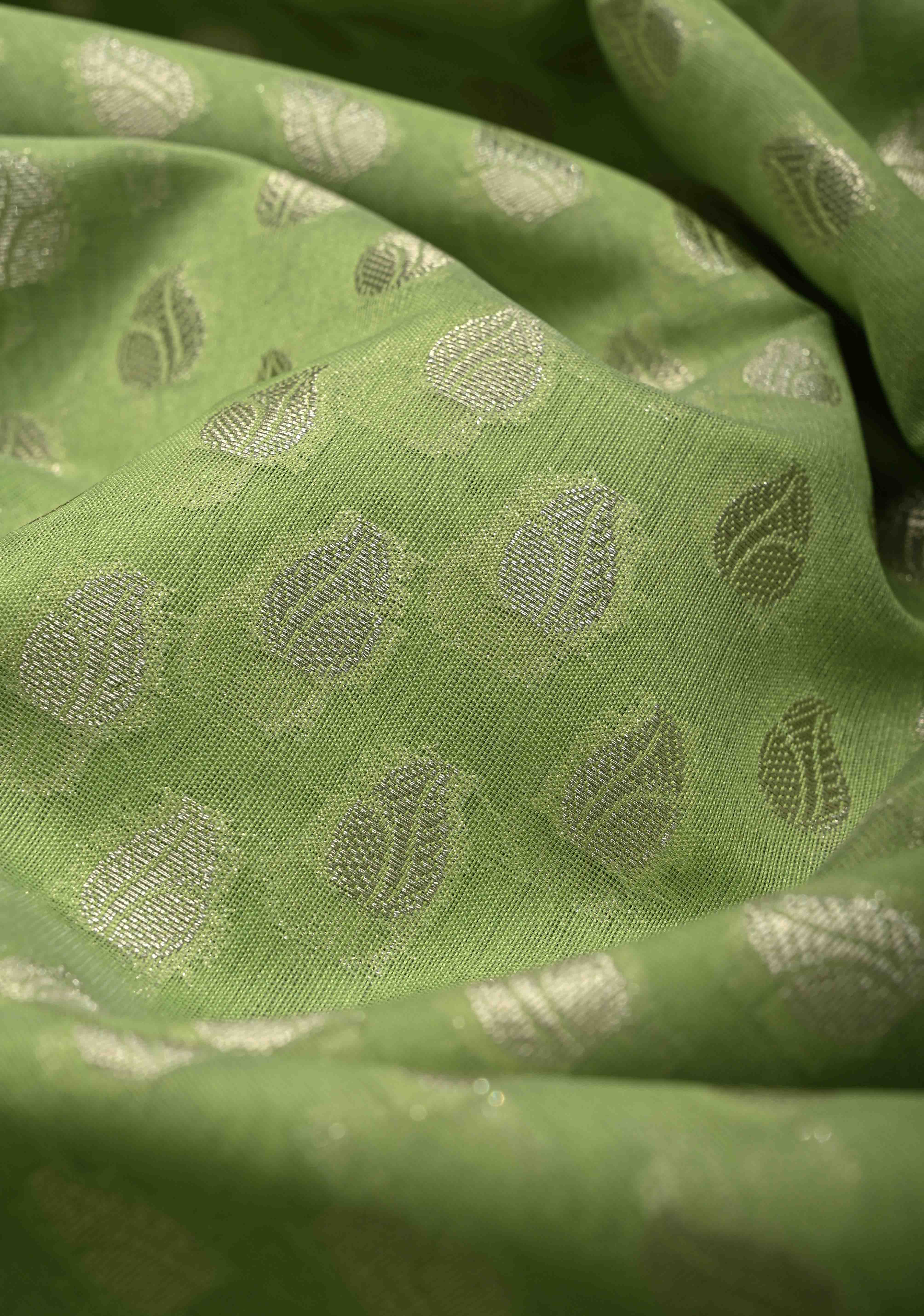 Pista Green Banarasi Semi Kora Saree with Silver Zari Buttas and Zari Border | Shobitam
