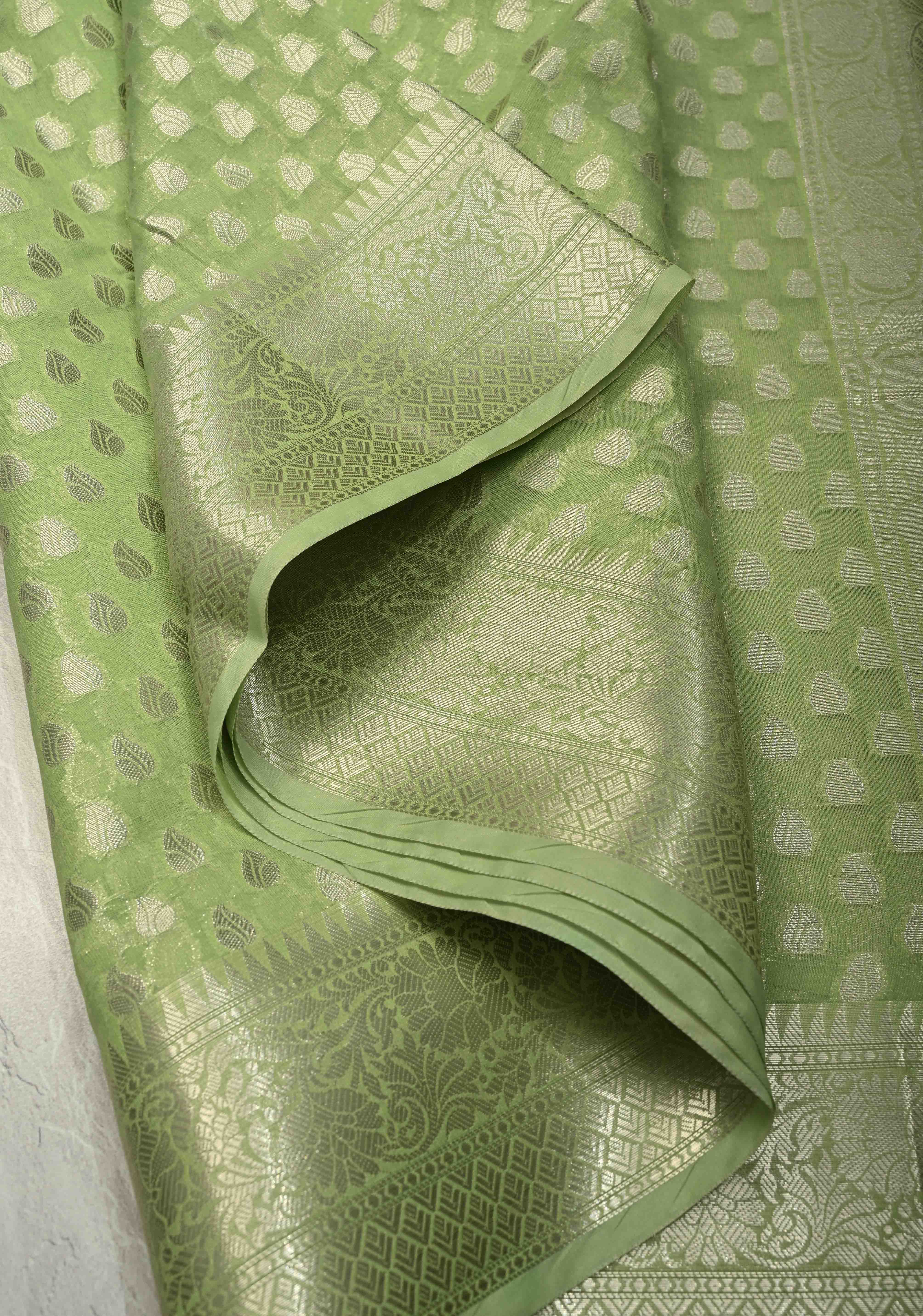 Pista Green Banarasi Semi Kora Saree with Silver Zari Buttas and Zari Border | Shobitam