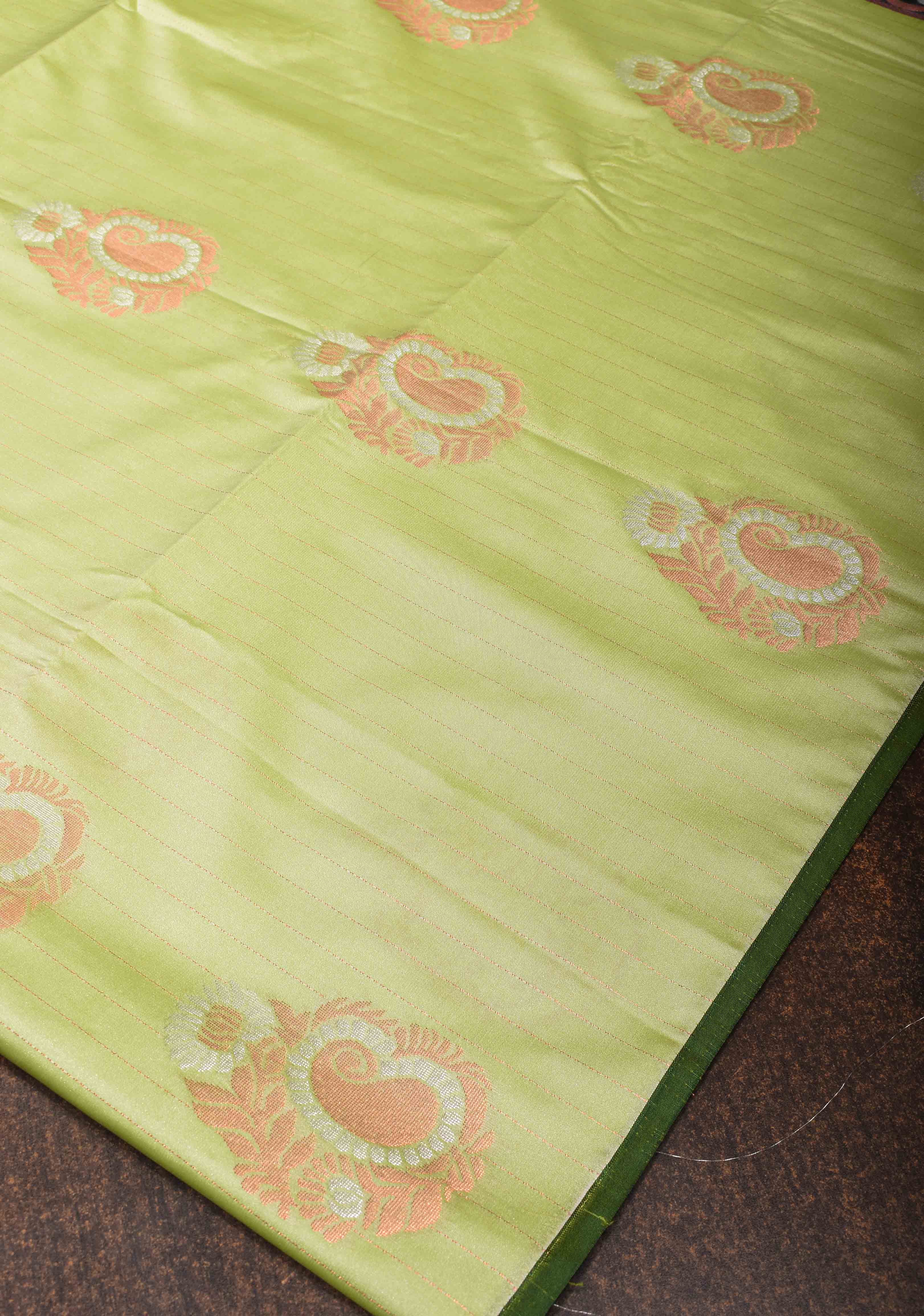 Tea Green Borderless Semi Silk Saree with Zari Stripes and Alfi Paisley Motifs | Shobitam