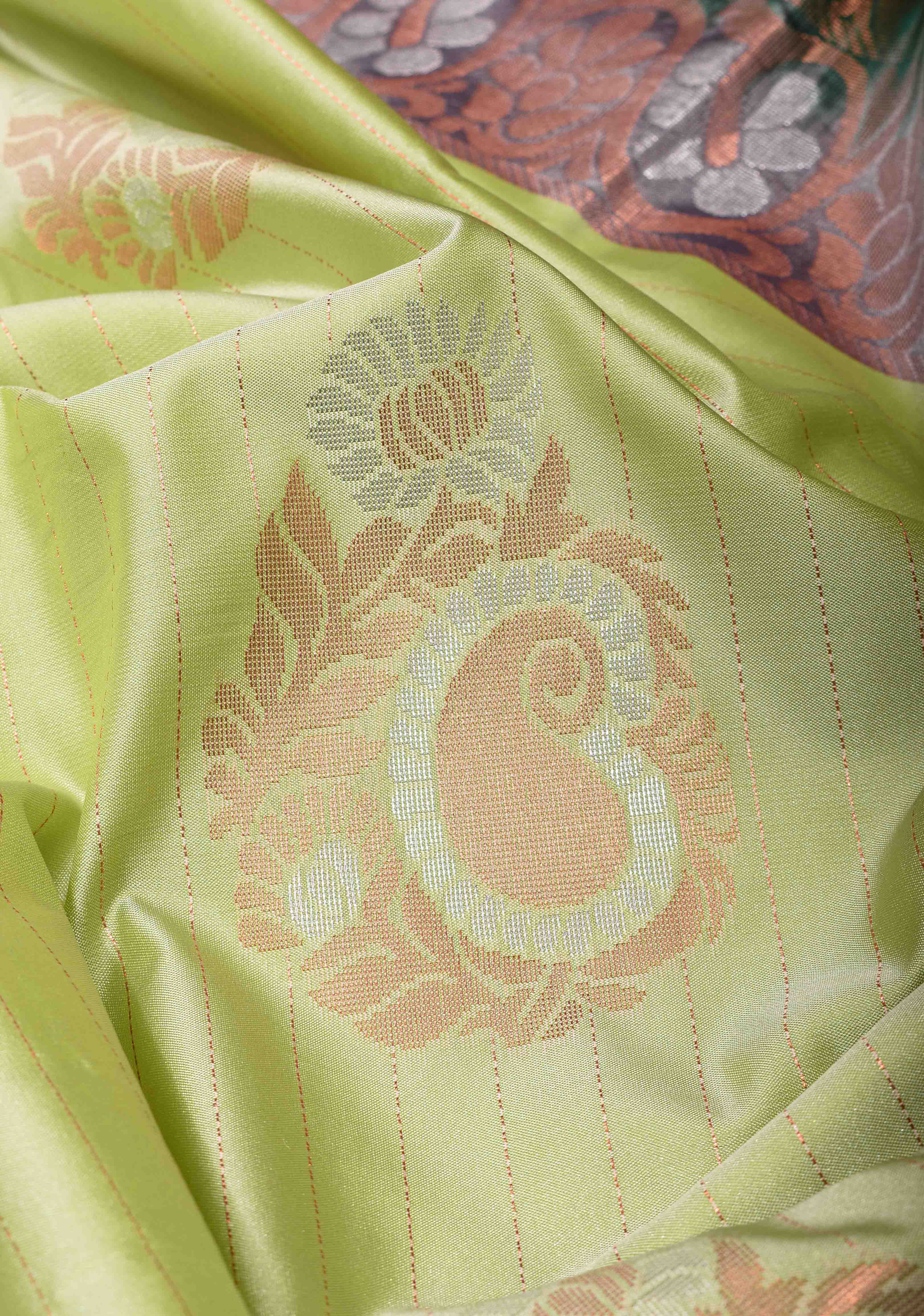 Tea Green Borderless Semi Silk Saree with Zari Stripes and Alfi Paisley Motifs | Shobitam