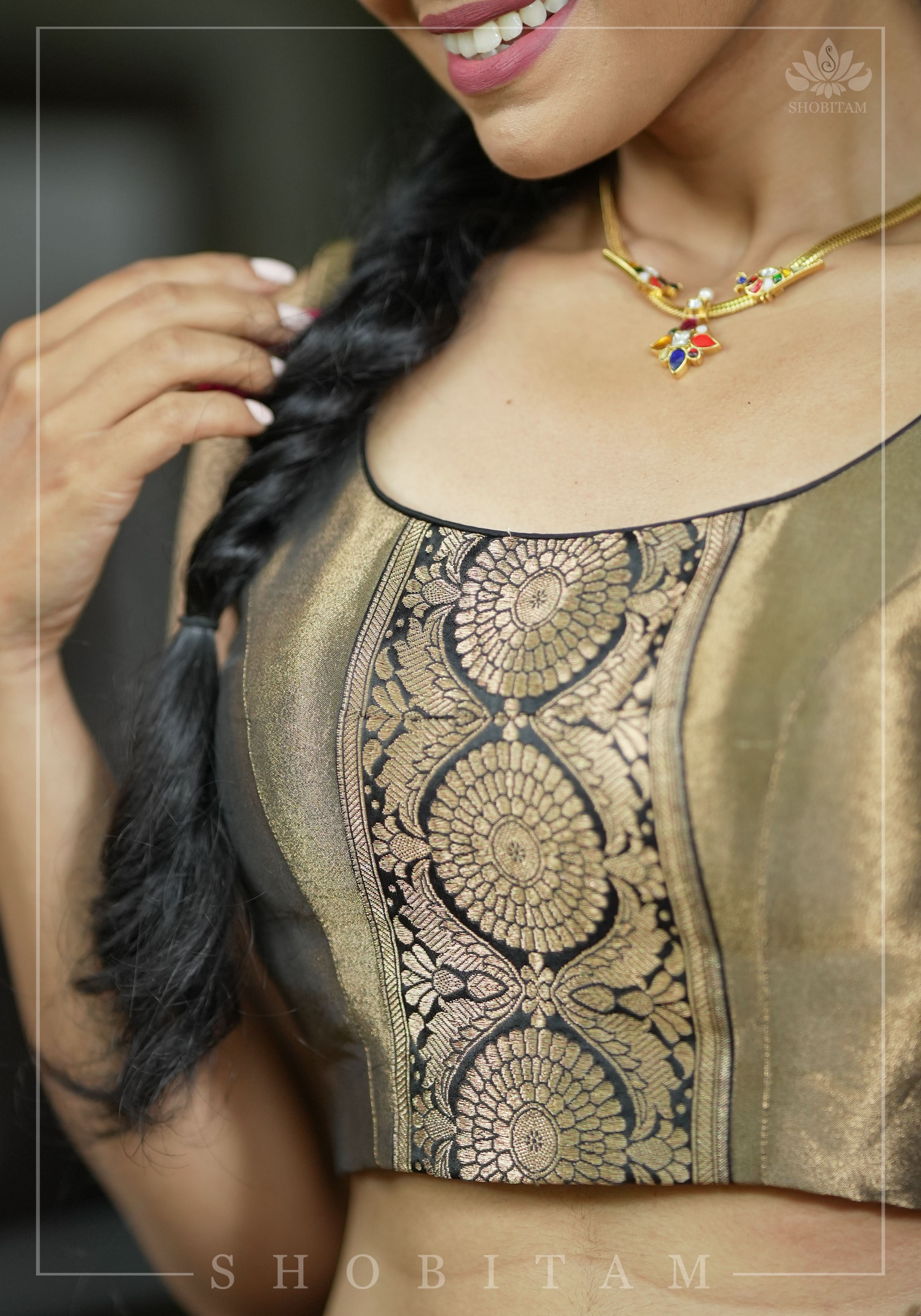 Bronze tissue brocade U neck sleeveless blouse with black brocade detailing | Shobitam