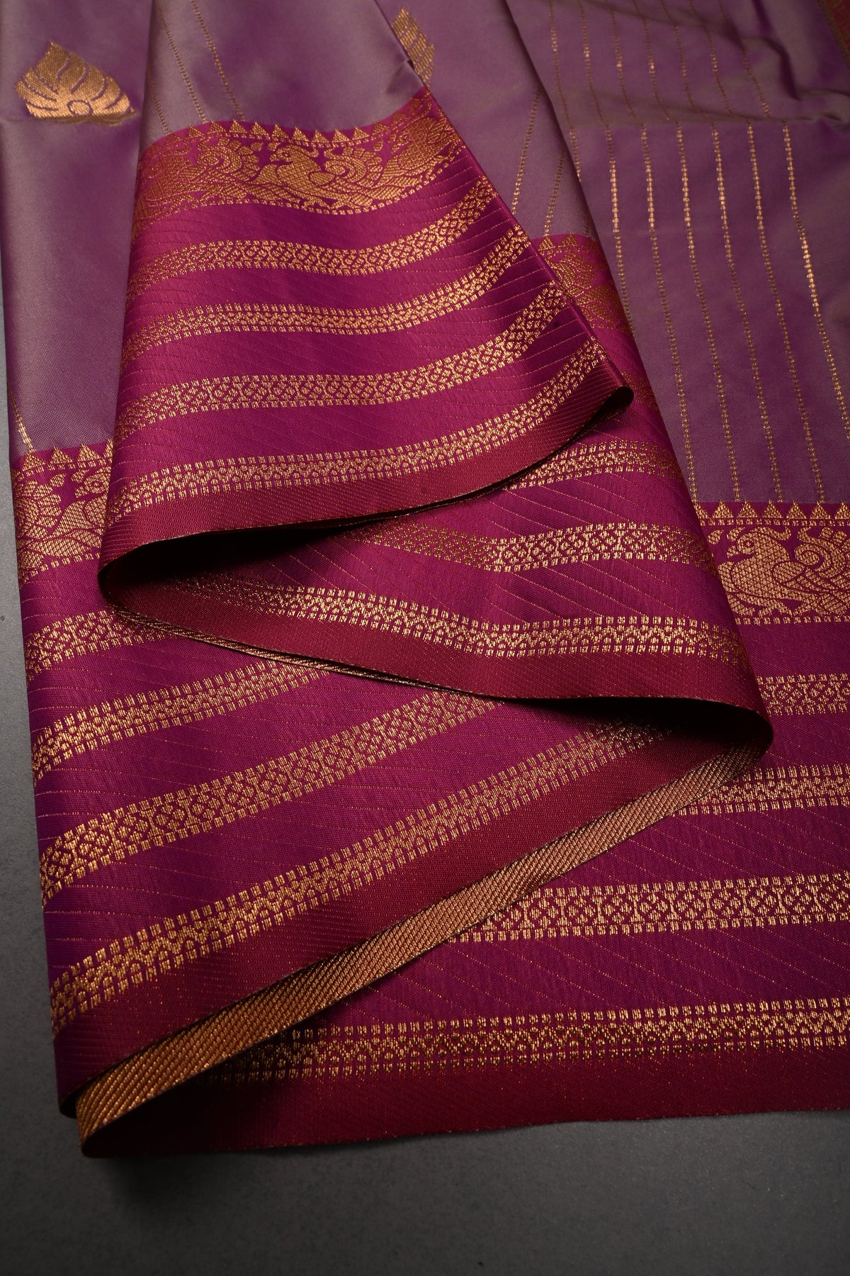 Purple Dual tone Vertical Zari Stripes on Kanchi Semi Silk Saree with Zari Buttas and Contrast Zari Border | SHOBITAM