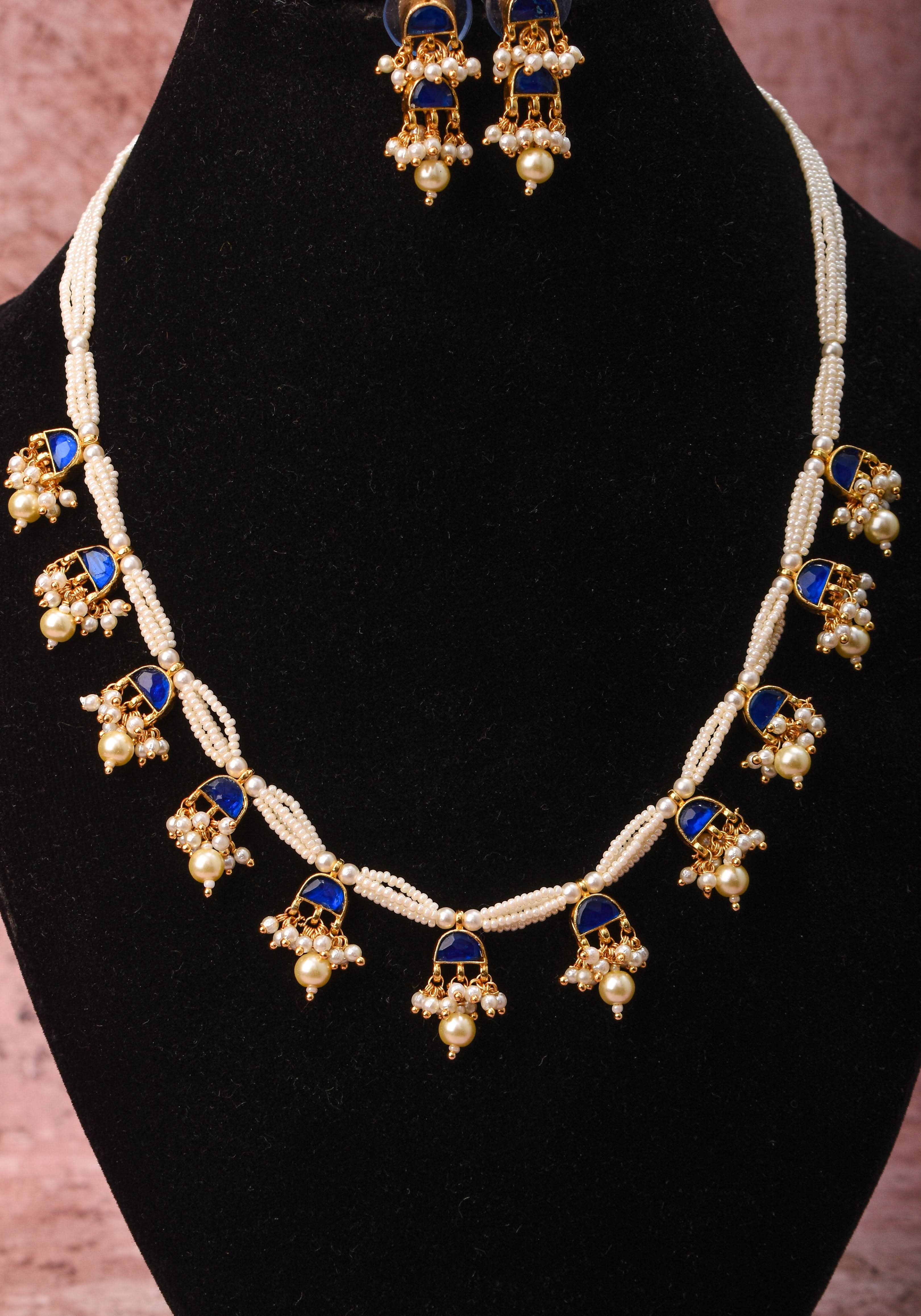 Lightweight Jadau Necklace Set with eleven dangling royal blue stones and matching earrings | Shobitam Jewelry