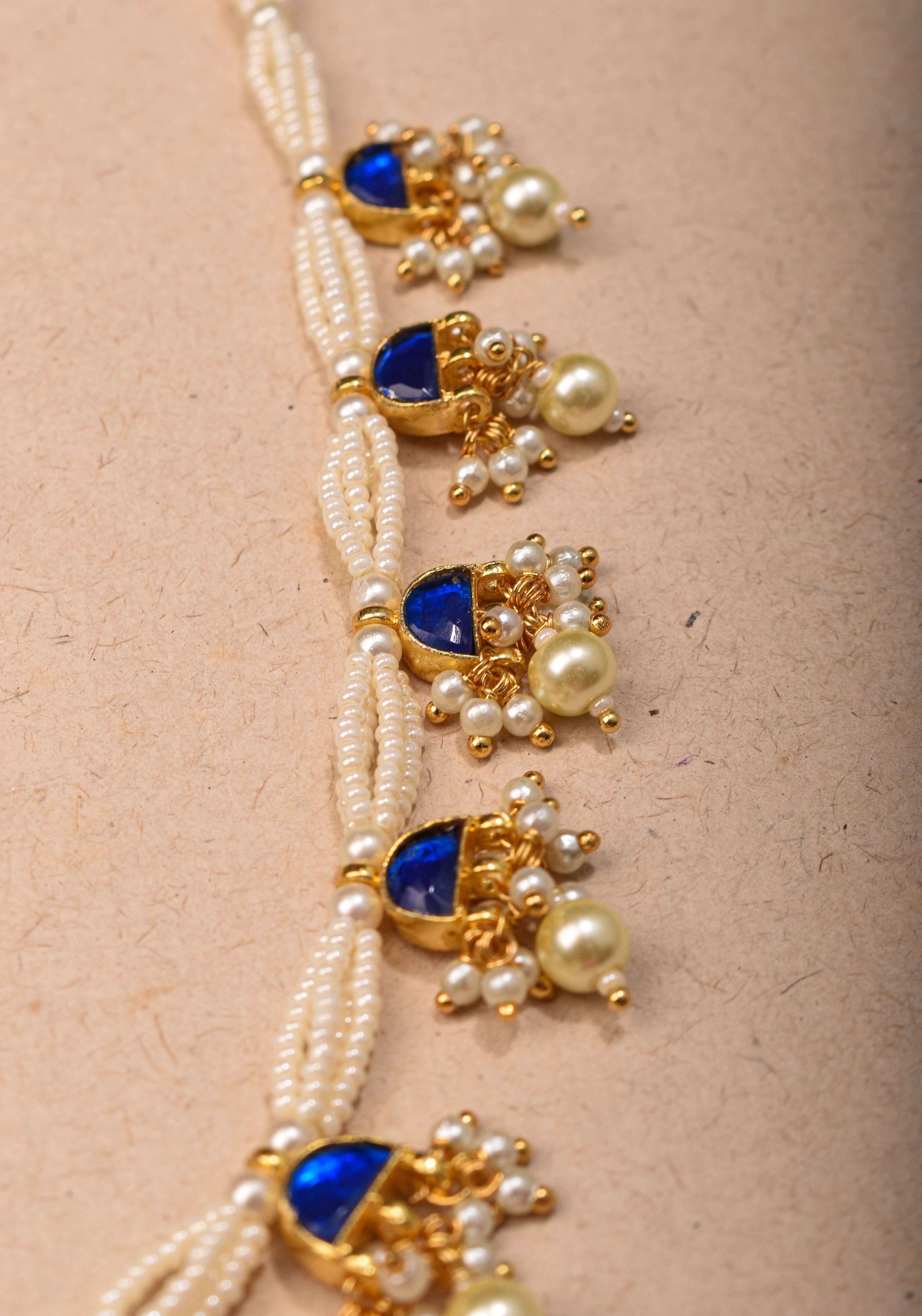 Lightweight Jadau Necklace Set with eleven dangling royal blue stones and matching earrings | Shobitam Jewelry