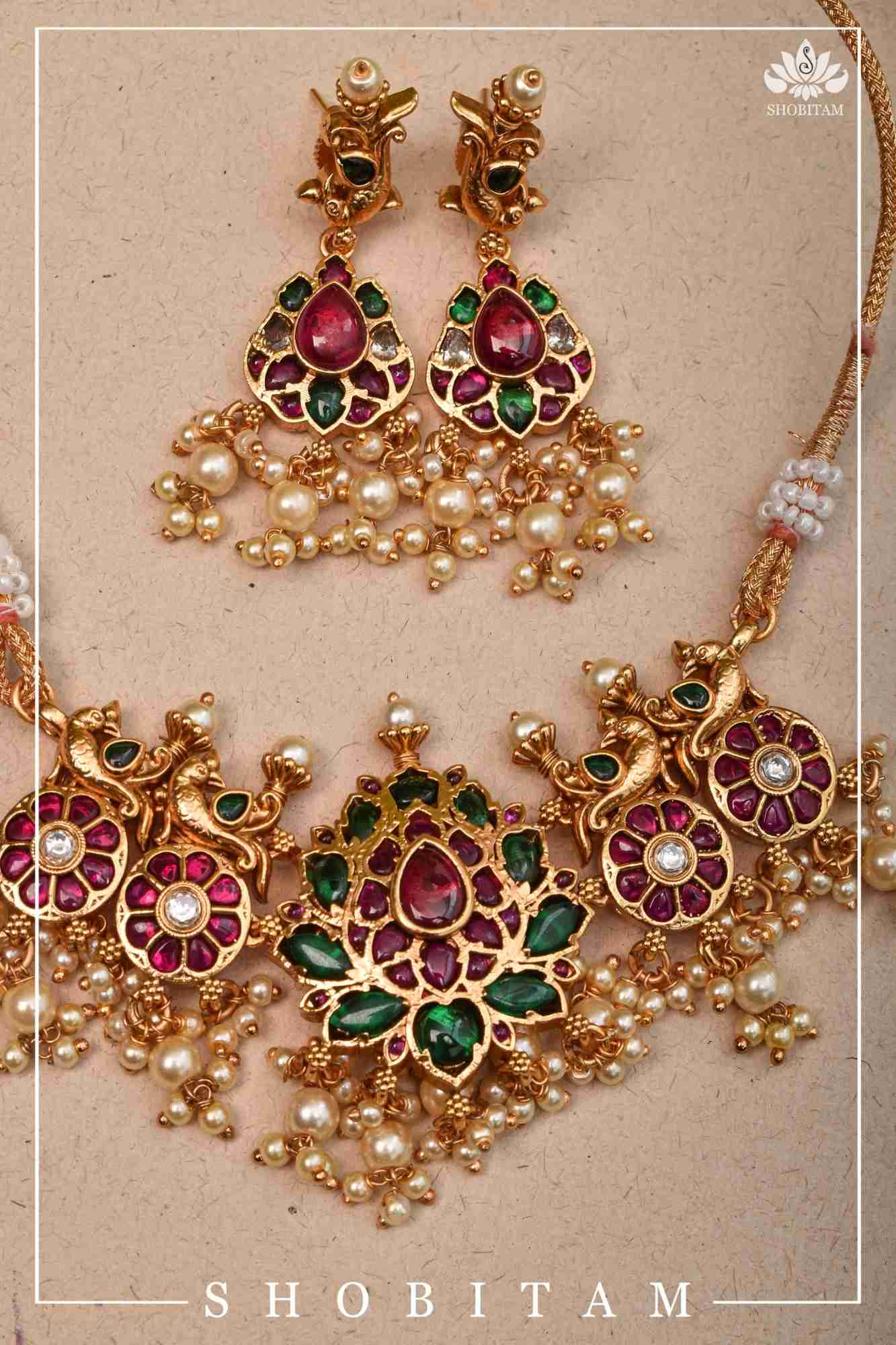 Jadau Lotus Stone Embellishment with Peacock units Choker Set In Green,Pink and white With Matching Earrings