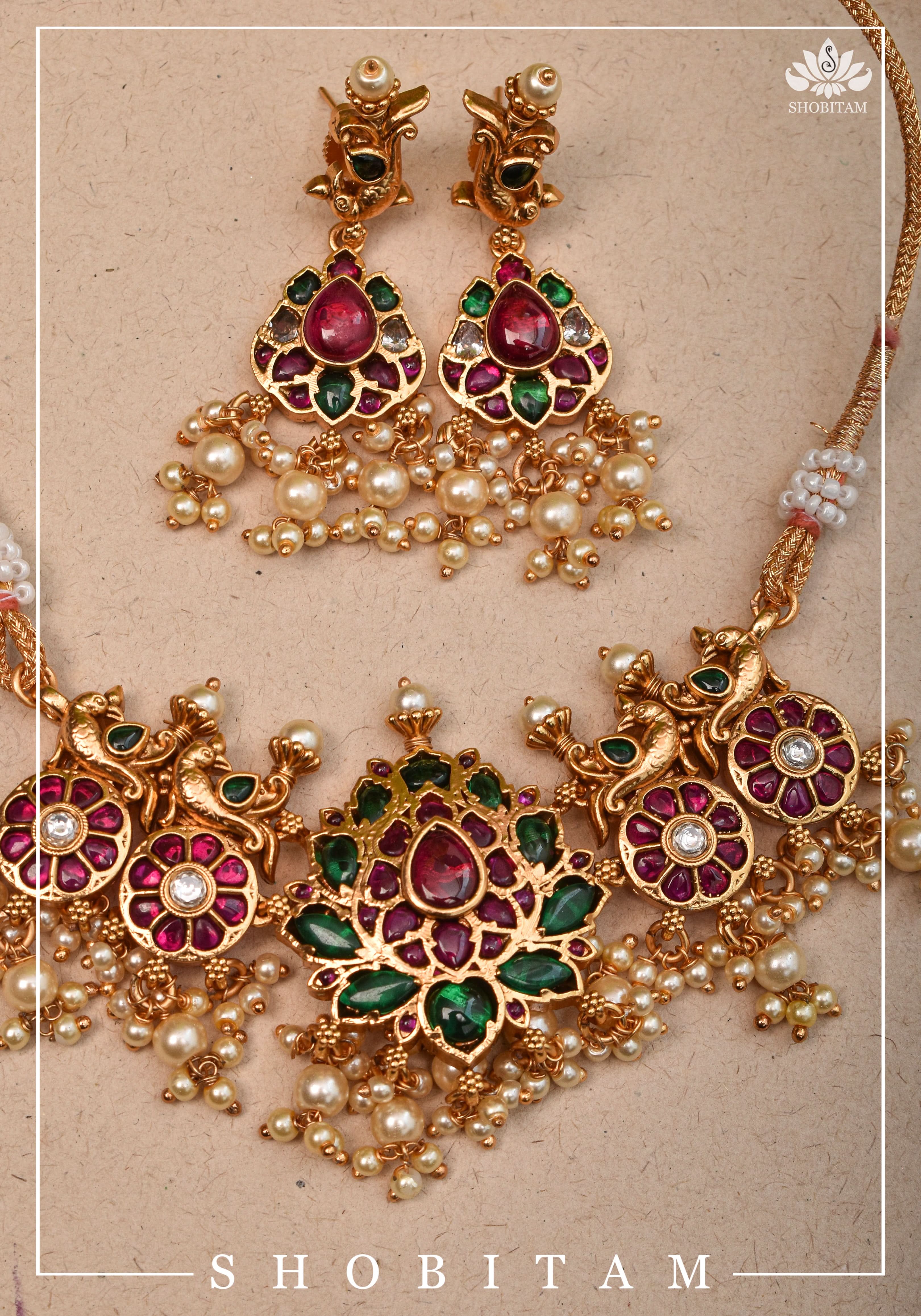 Jadau Lotus Stone Embellishment with Peacock units Choker Set In Green,Pink and white With Matching Earrings | Shobitam