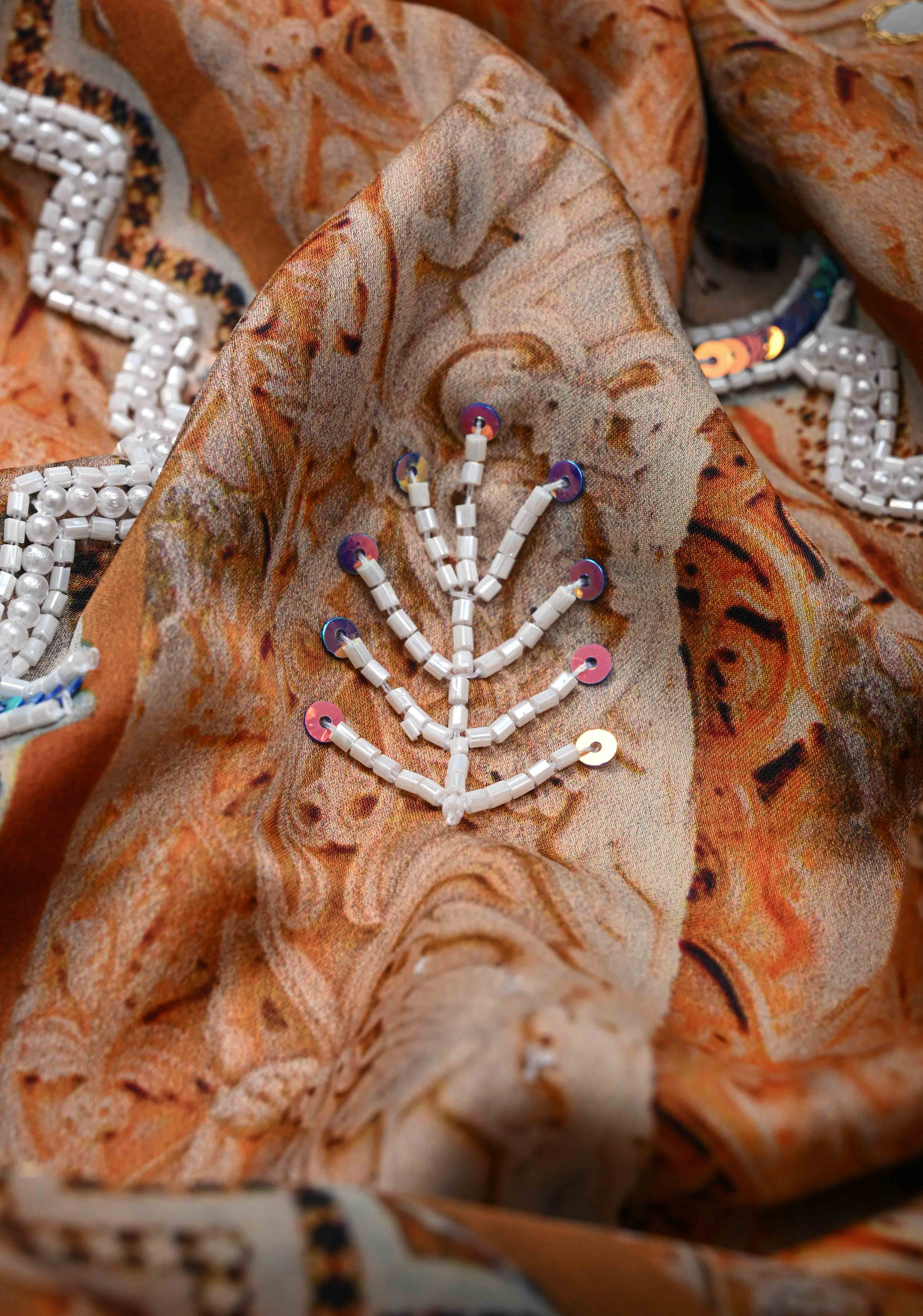 Beige and Peach Crepe Georgette Silk Saree with digital Print, Sequins, Cutdana, Mirror and Moti Beads Detailing | Shobitam
