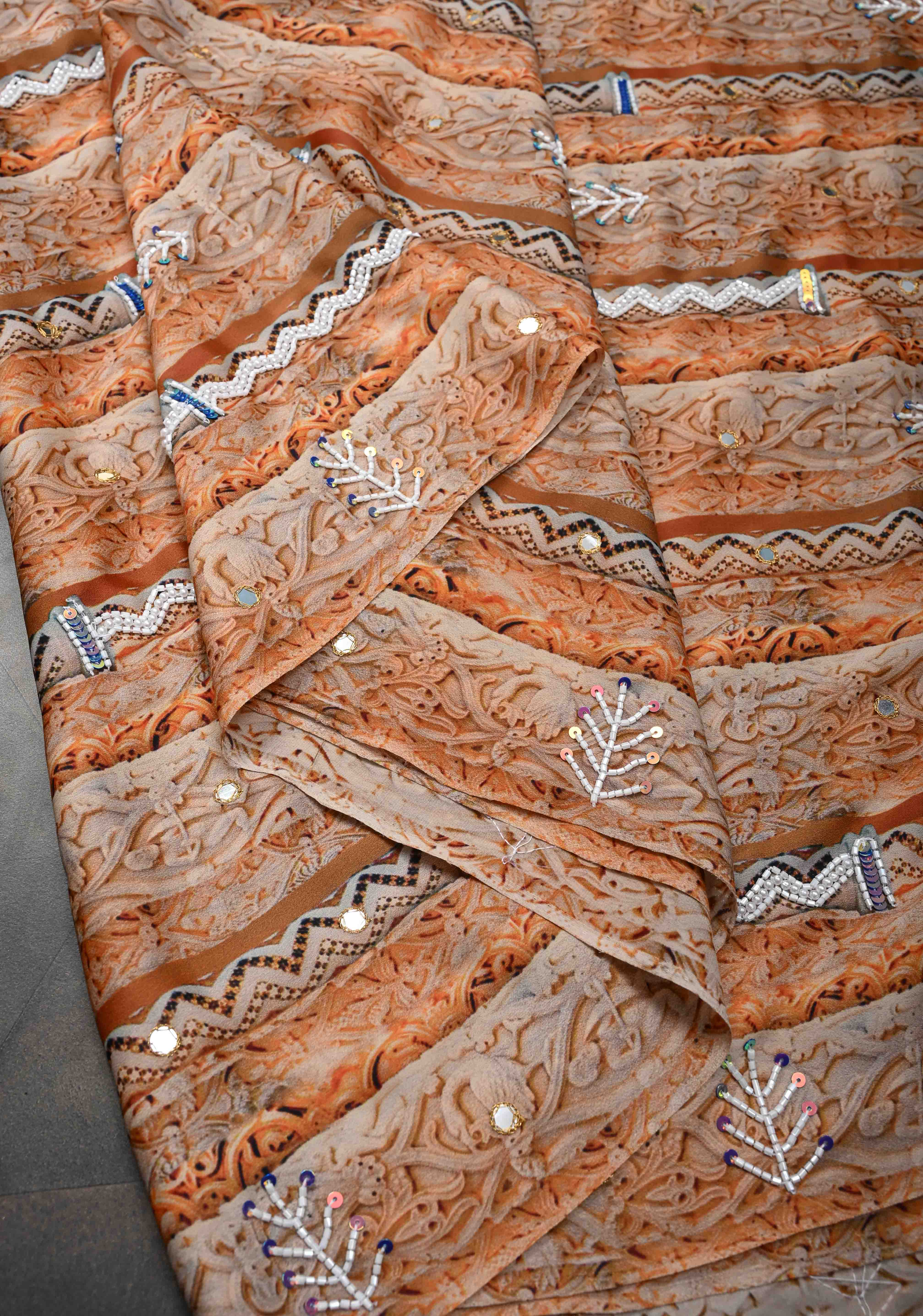 Beige and Peach Crepe Georgette Silk Saree with digital Print, Sequins, Cutdana, Mirror and Moti Beads Detailing | Shobitam