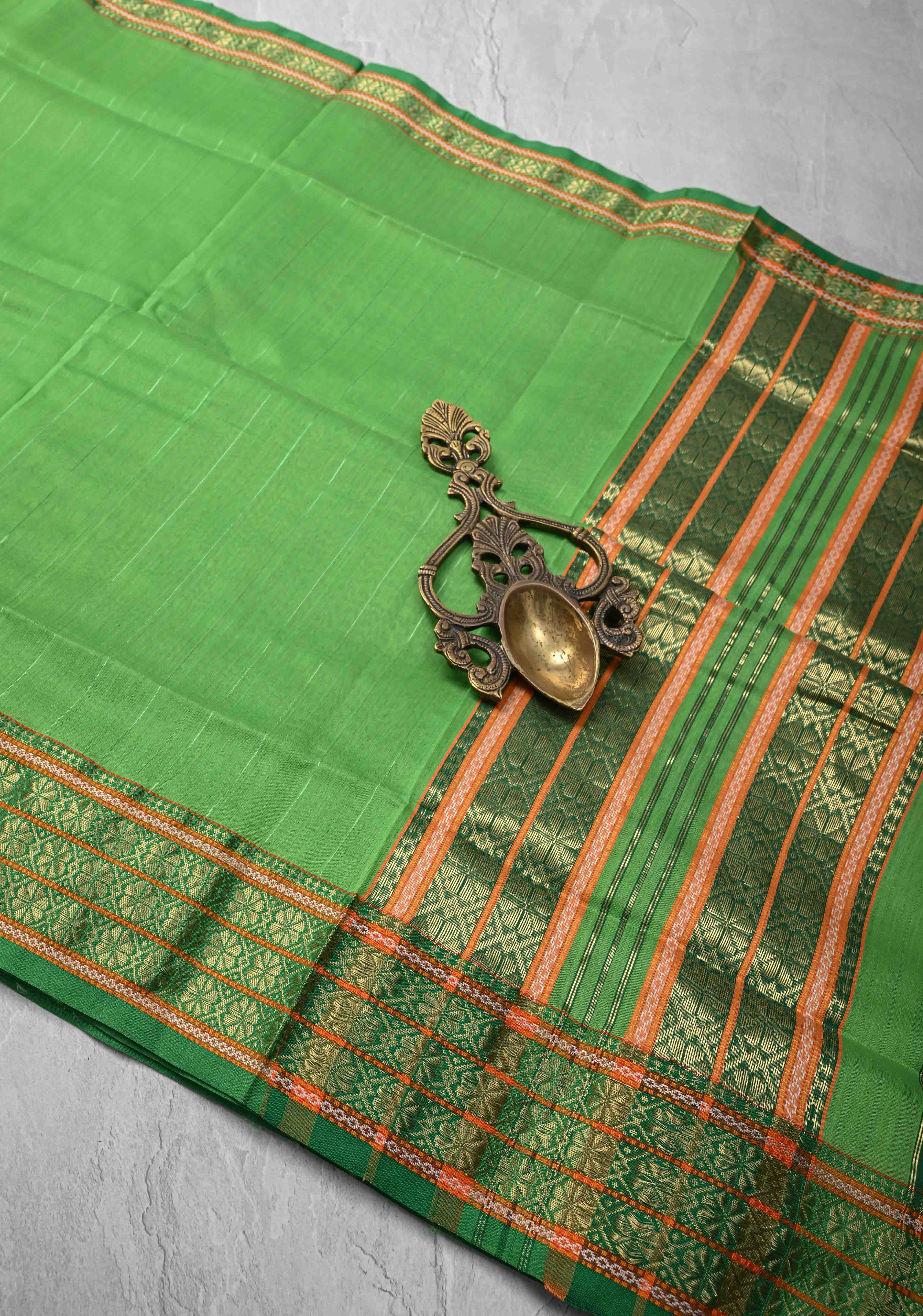 Parrot Green Handwoven Maheshwari Silk Cotton Saree with Muted Stripes and Zari Borders | Shobitam