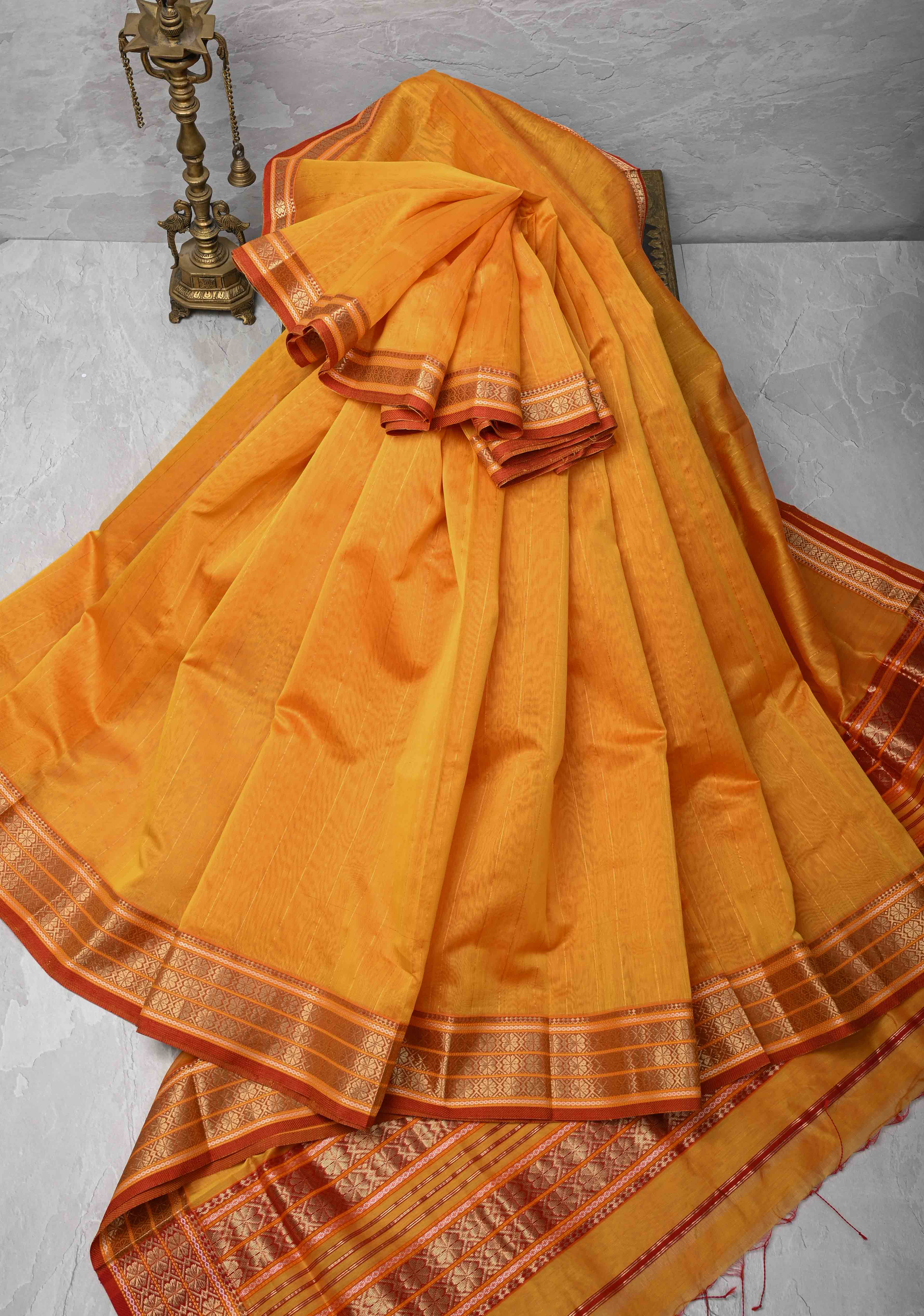 Mustard Yellow Handwoven Maheshwari Silk Cotton Saree with Muted Stripes and Zari Borders | Shobitam