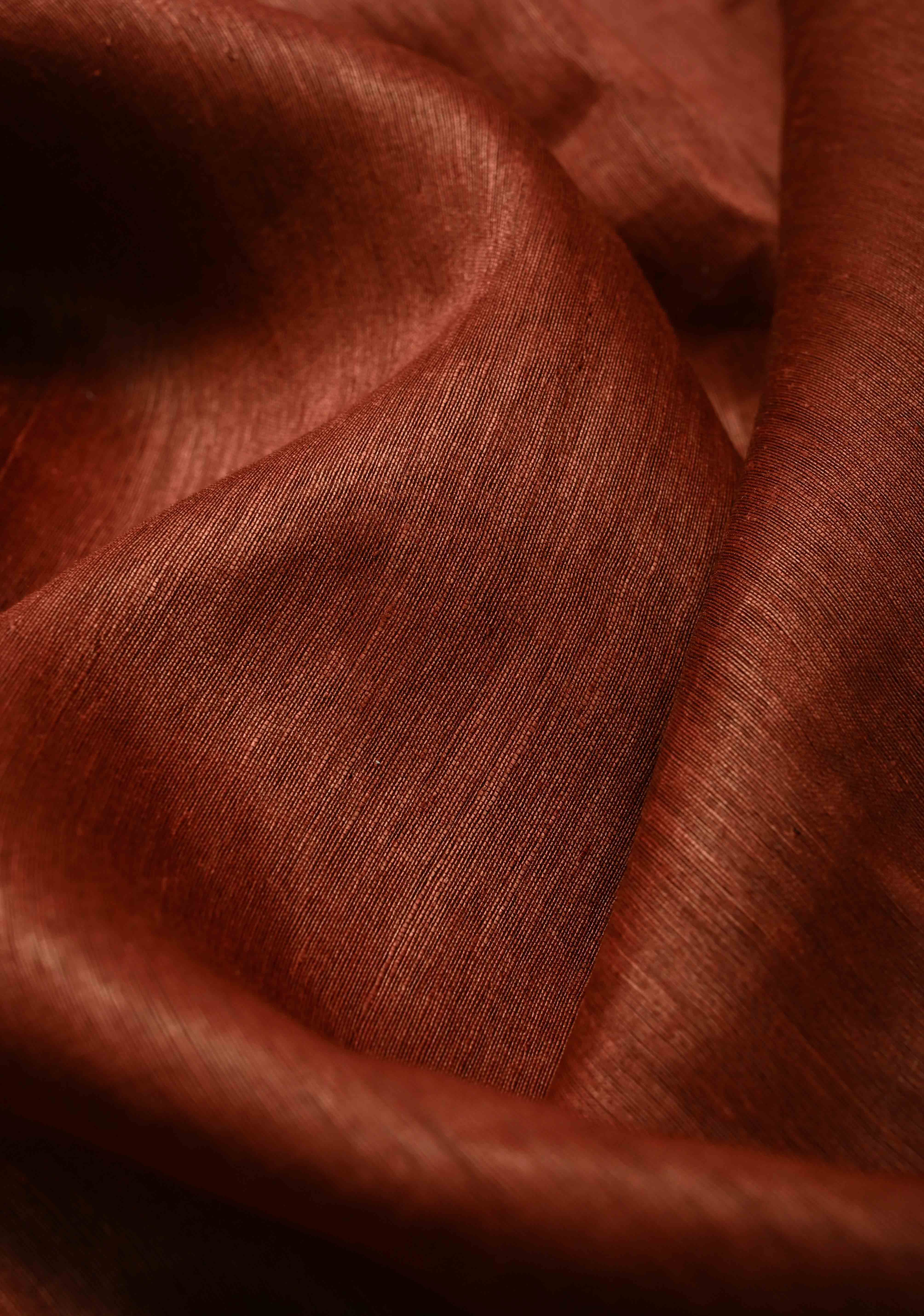 Copper Rust Silk Linen Saree with Muted Tissue Border and Floral Buttas on Pallu | Shobitam