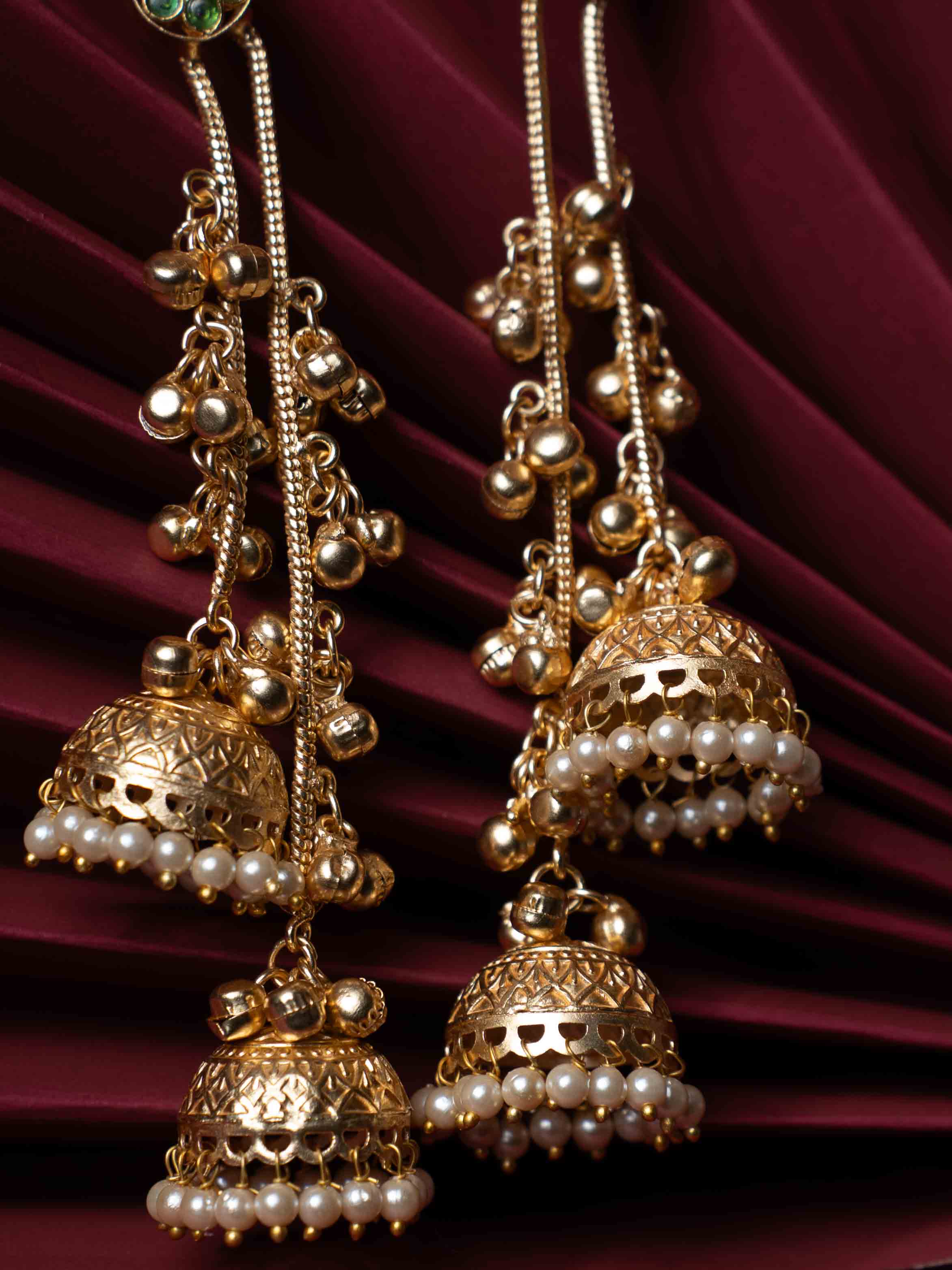 Gold Plated Bird Motif Long Jhumka Earrings with Pearl Drops & Green Stone Accents