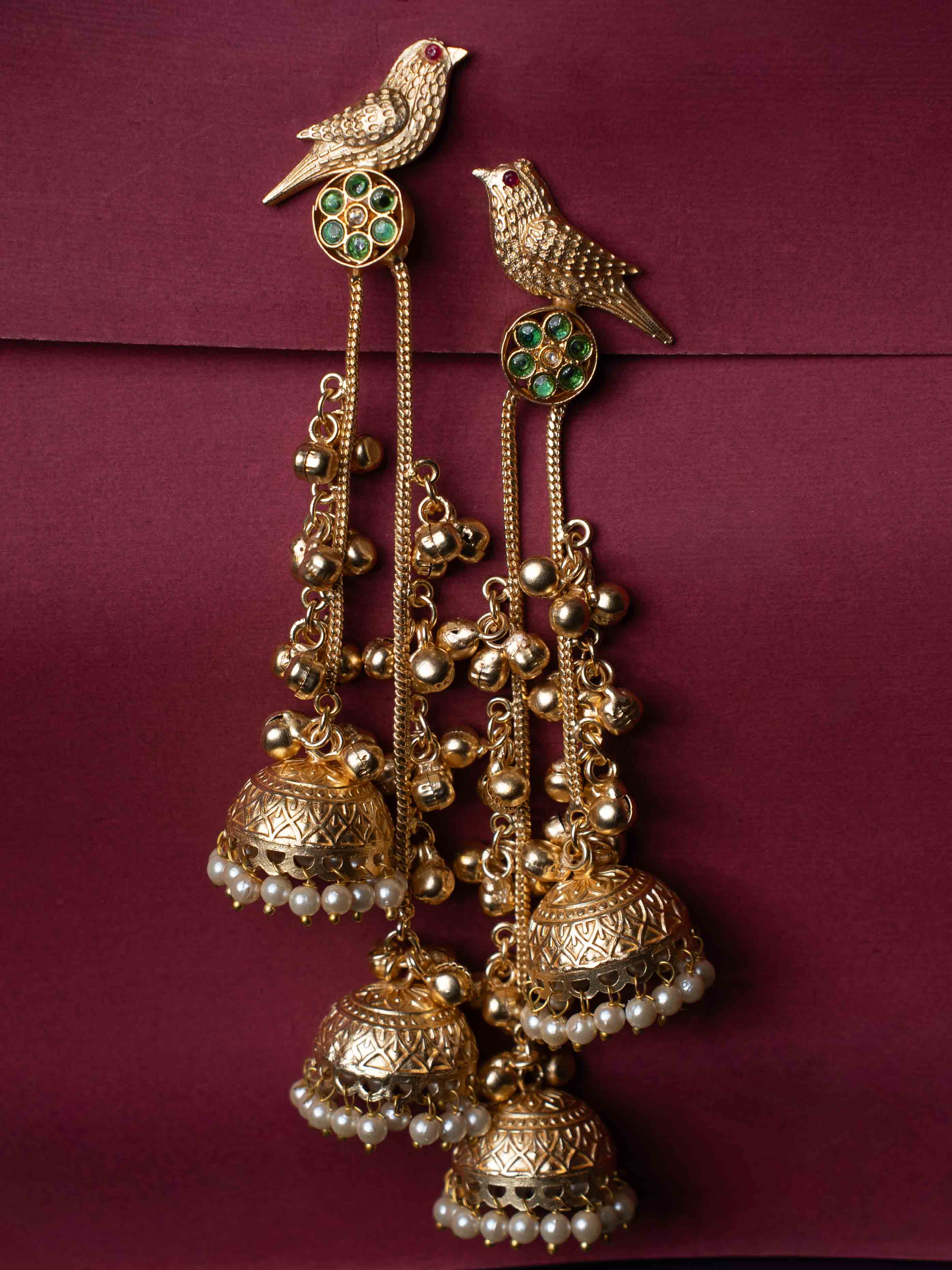 Gold Plated Bird Motif Long Jhumka Earrings with Pearl Drops & Green Stone Accents