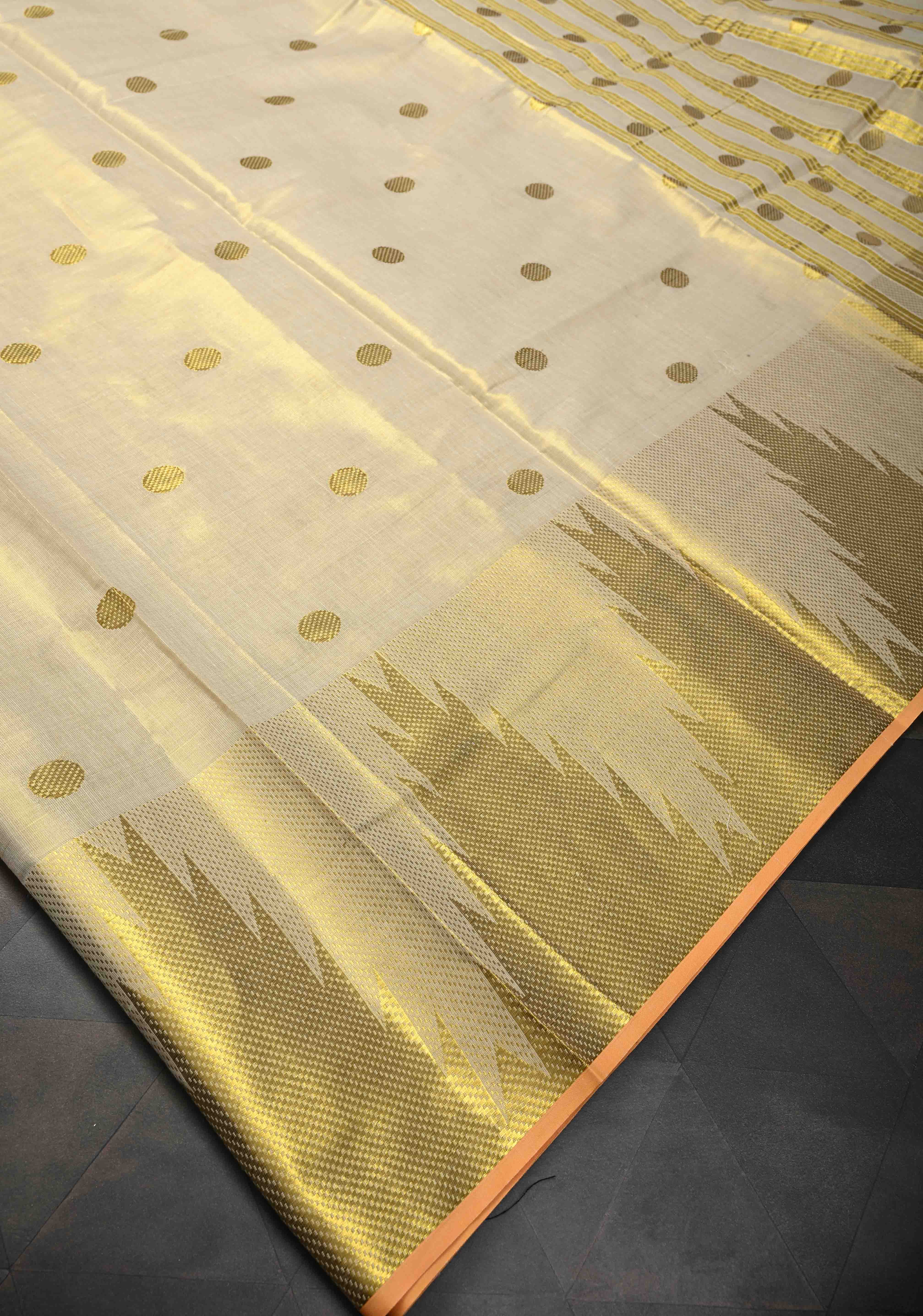 Beige Tissue Cotton Saree with Zari Coin Buttis And Temple Border | Shobitam